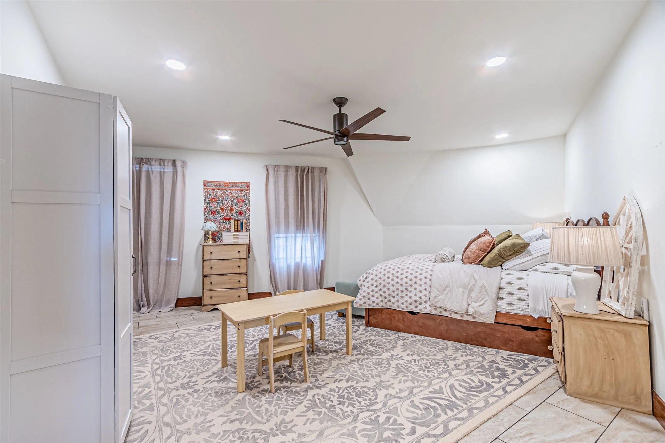 Spacious room featuring recessed lighting, a ceiling fan, and tile flooring
