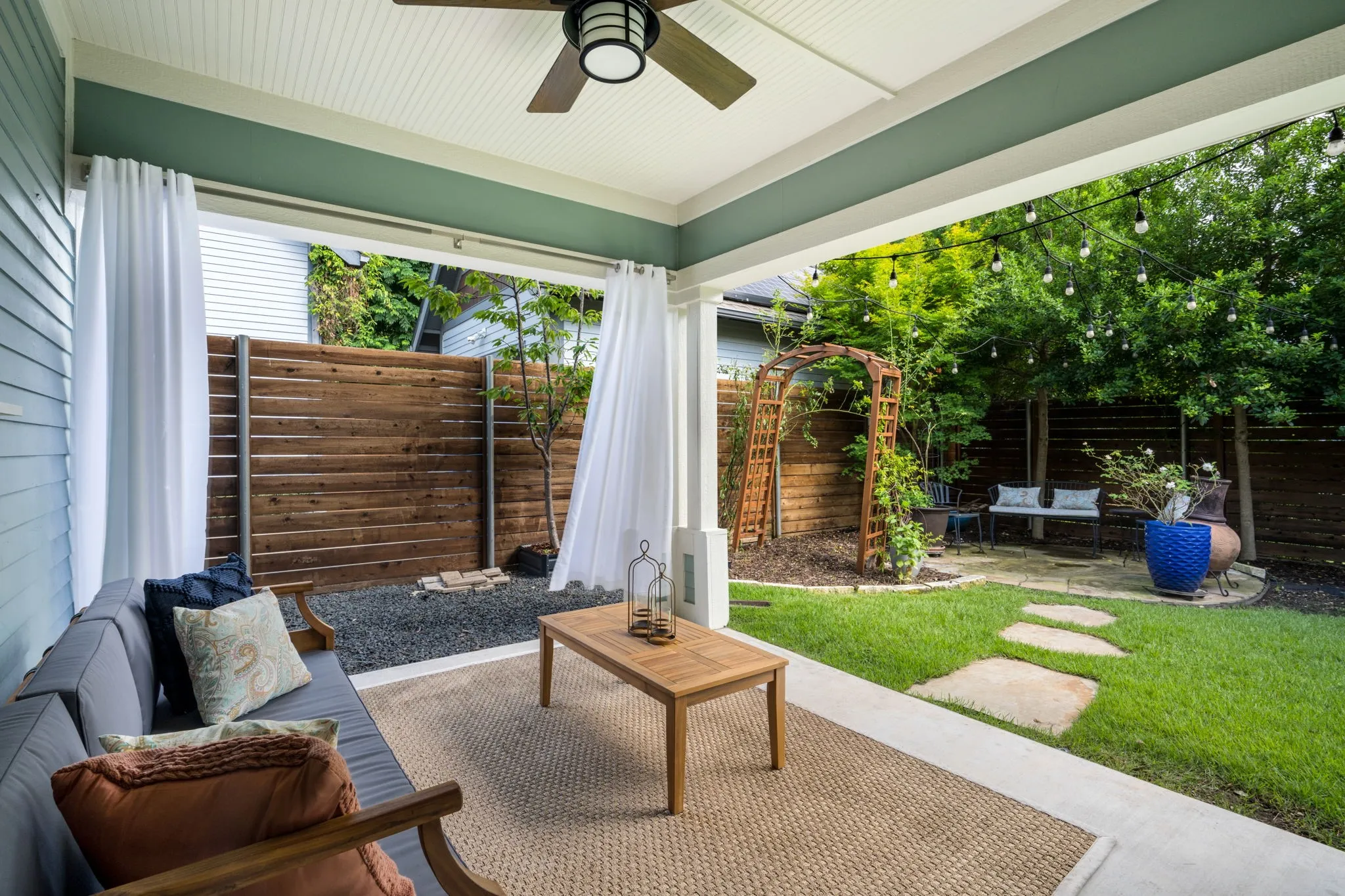     Covered outdoor living space designed for year-round entertaining and relaxation.