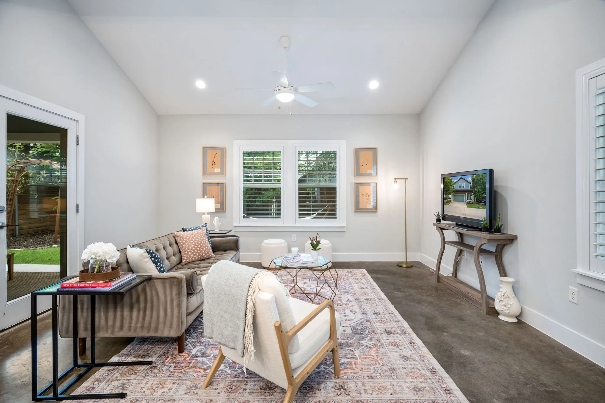     Open-concept living area with expansive windows and airy modern design.