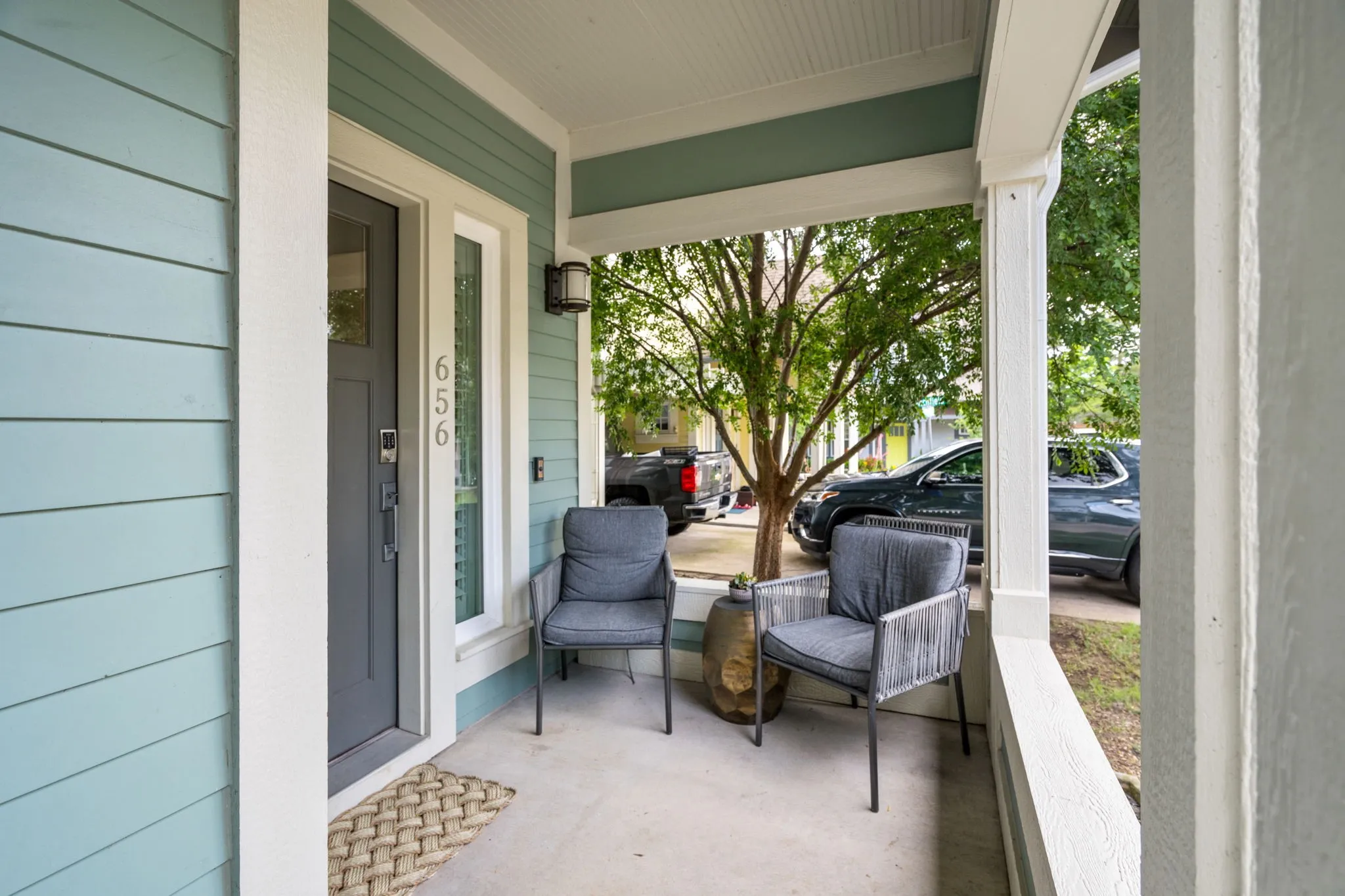     Inviting covered front porch perfect for morning coffee or evening conversations.