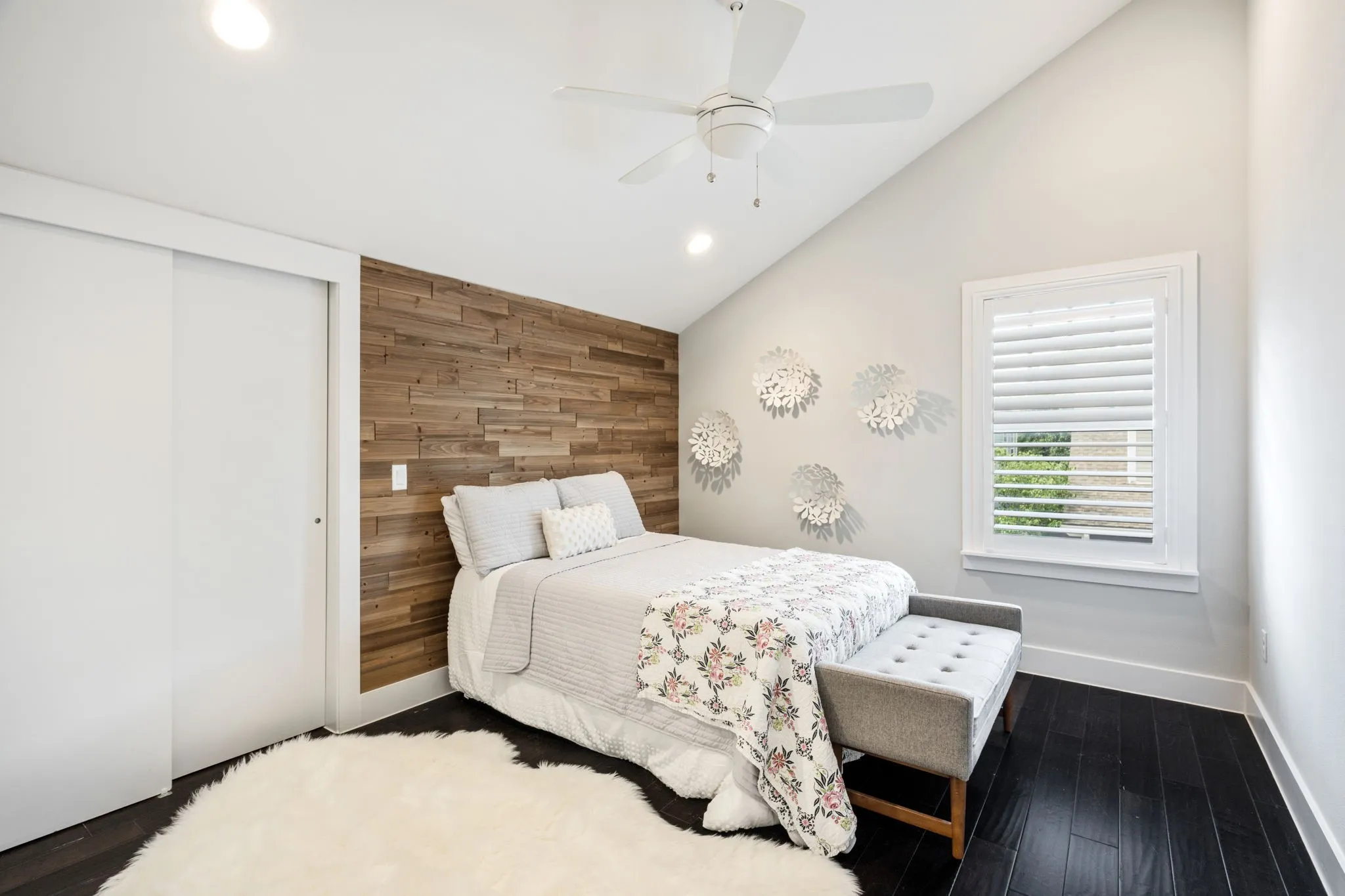     Flexible secondary bedroom or home office with vaulted ceiling and designer touches.