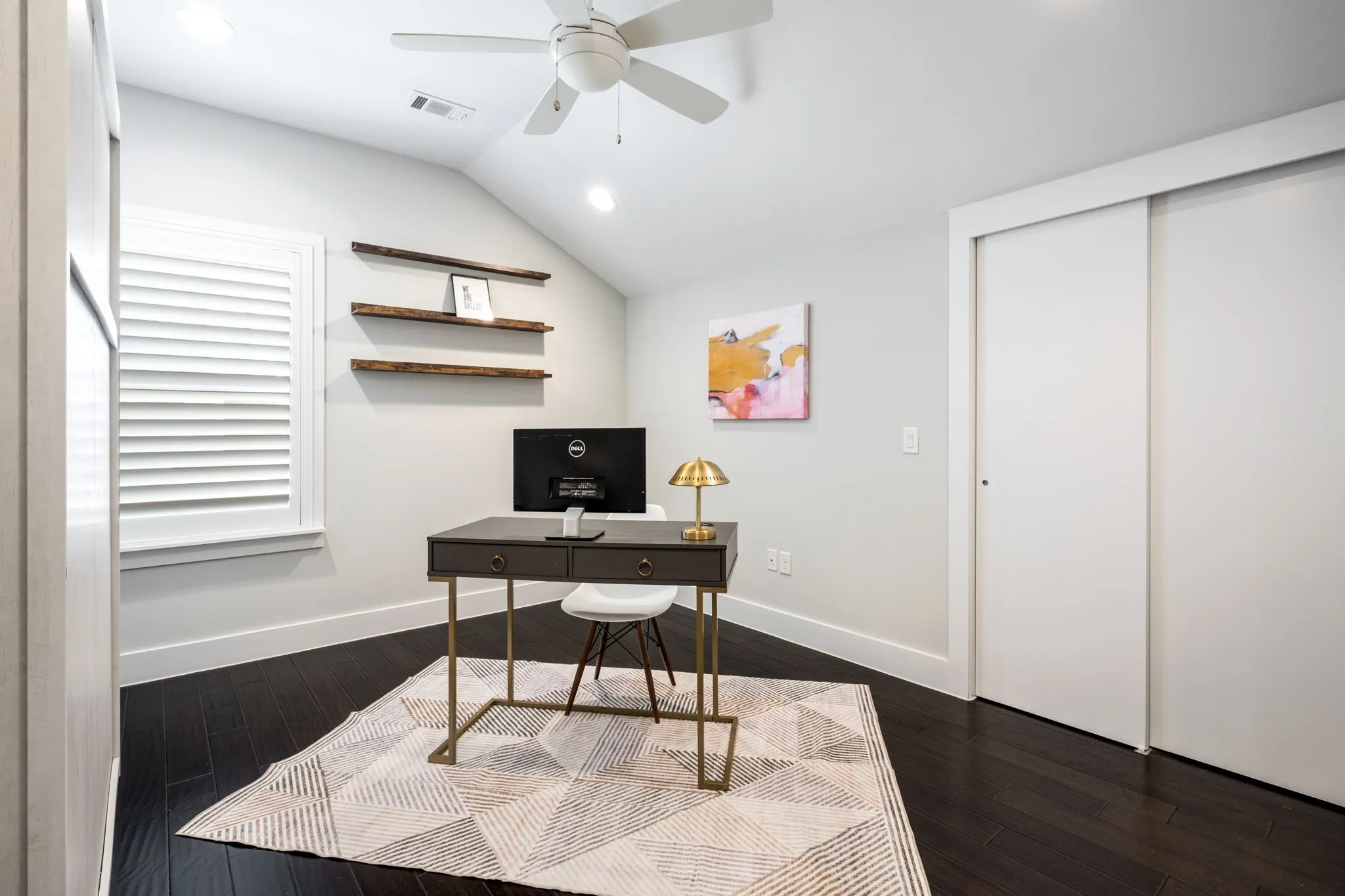     Flexible guest suite or home office featuring custom built-in Murphy bed and vaulted ceilings.