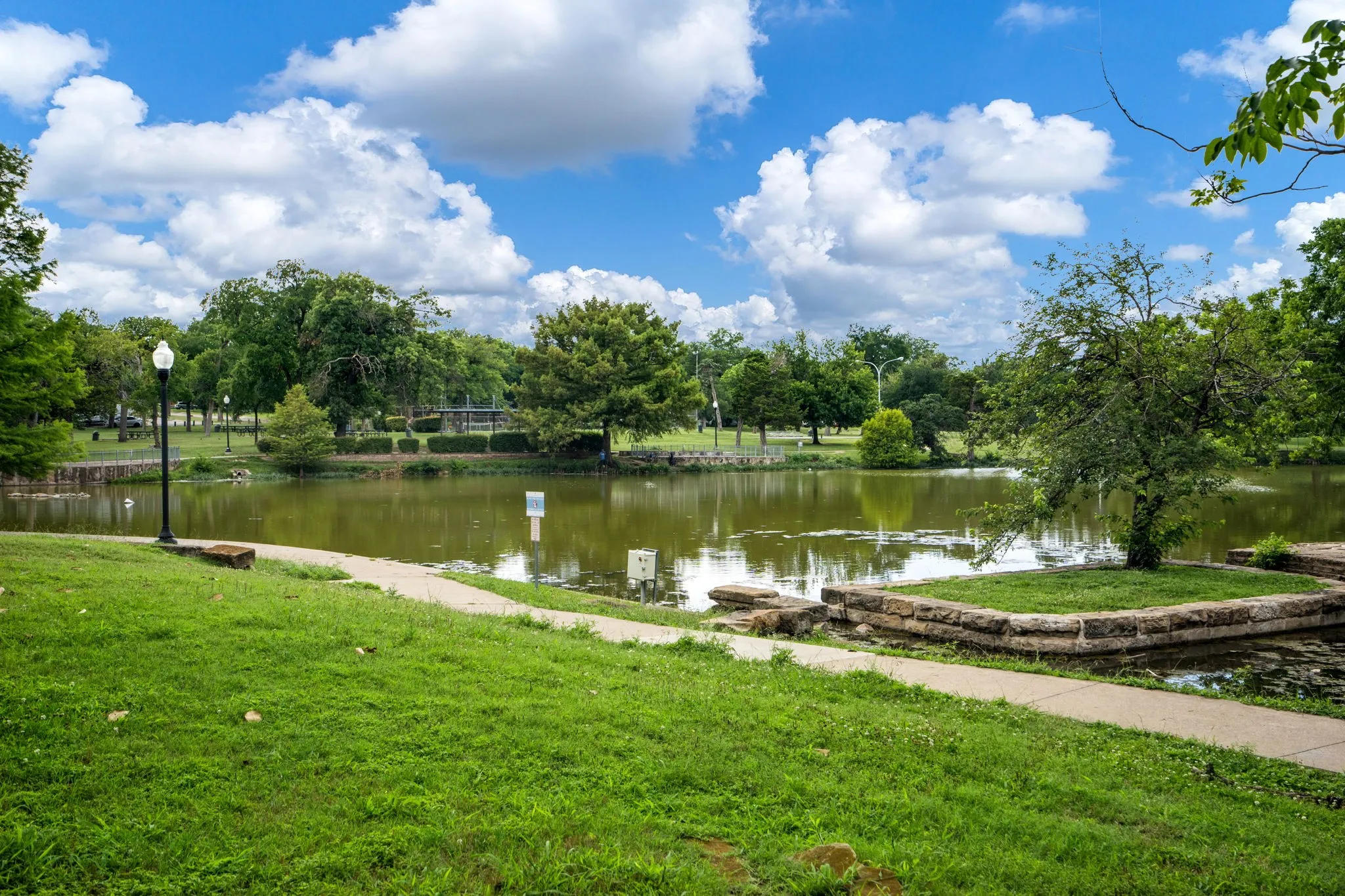     Just steps from Kidd Springs Park featuring scenic walking trails, tranquil creek views, open green space, and charming bridges woven through one of Oak Cliff’s most beloved historic parks.