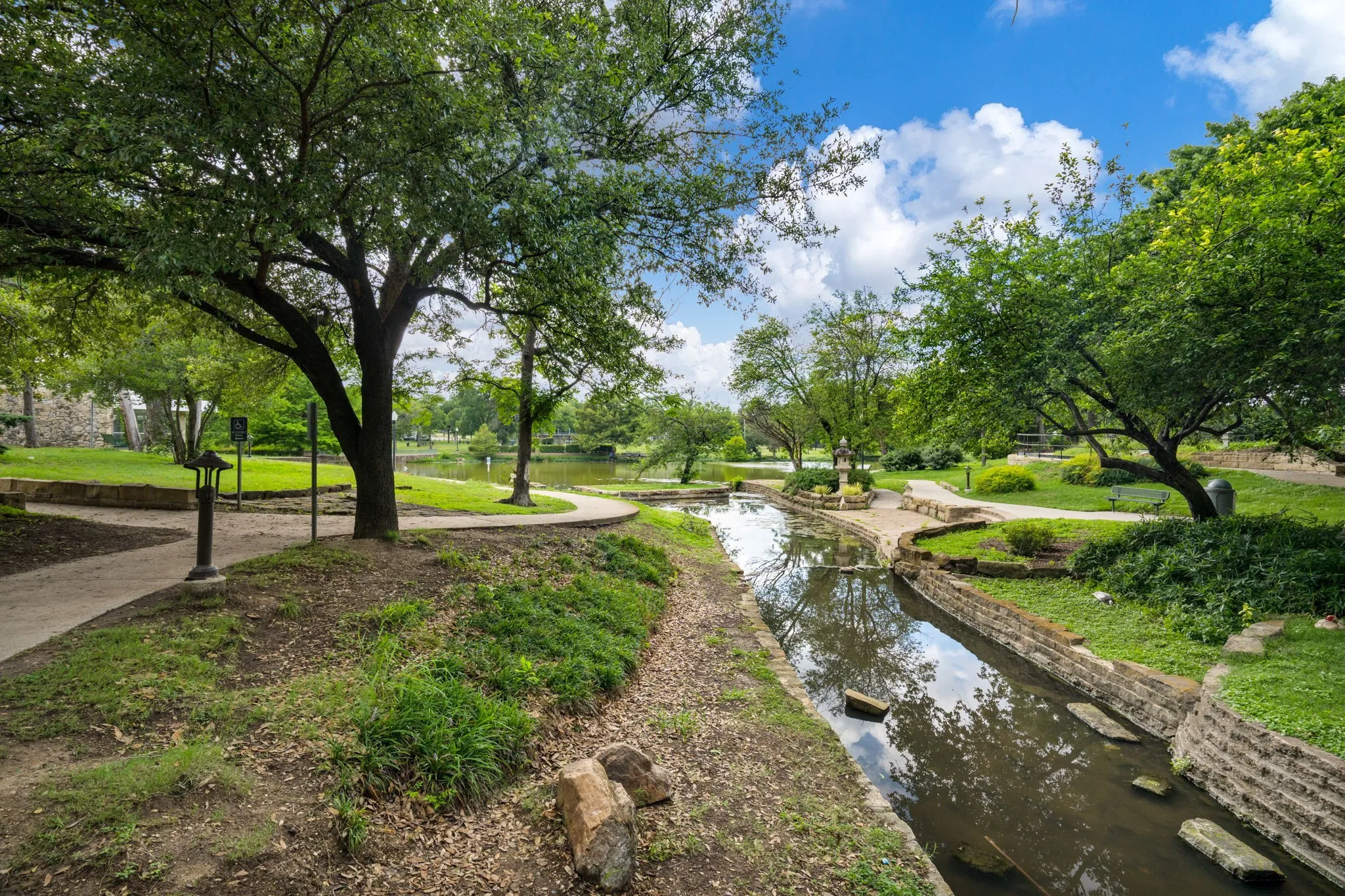     Steps from Kidd Springs Park with scenic walking paths, creek views, and lush green space.