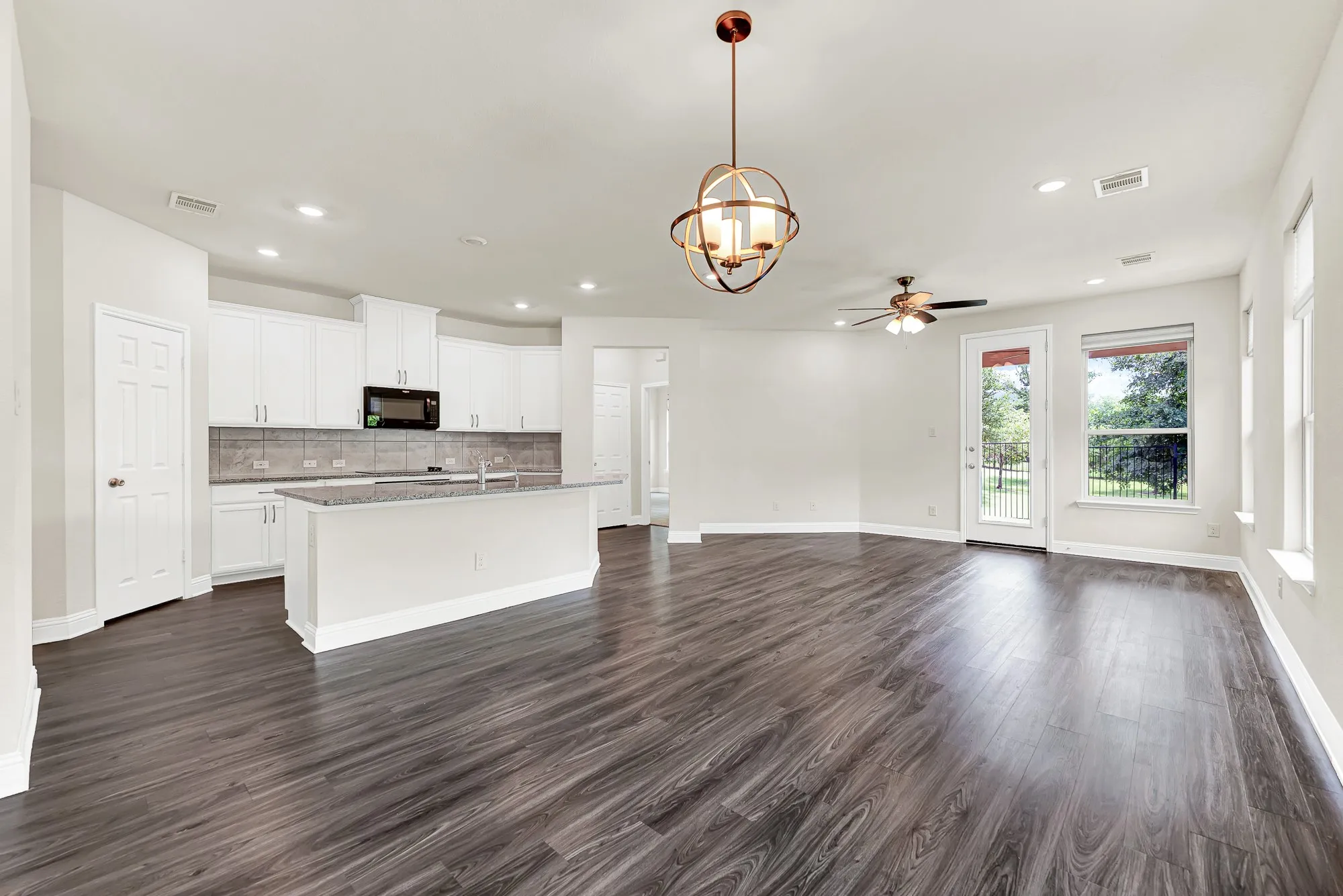 The back glass door serves as a direct portal to nature, instantly connecting the bright interior to the peaceful park-like views beyond. You will love opening the door on a crisp spring morning, letting the fresh breeze fill the entire main floor.