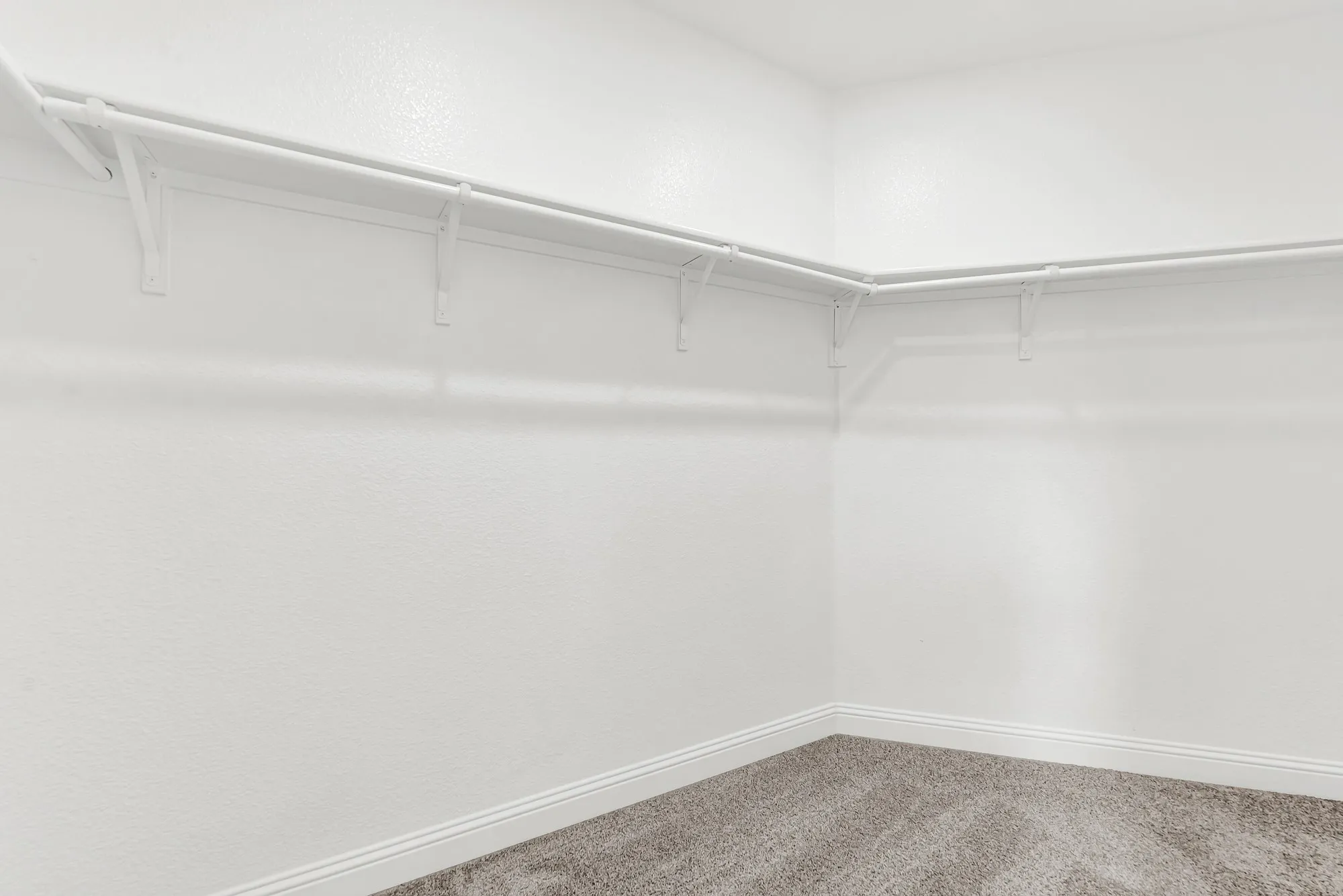 You can't help but fall in love with this immense walk-in closet in the primary suite! Just think of the possibilities to add your own unique storage options to truly make this a closet of your dreams.