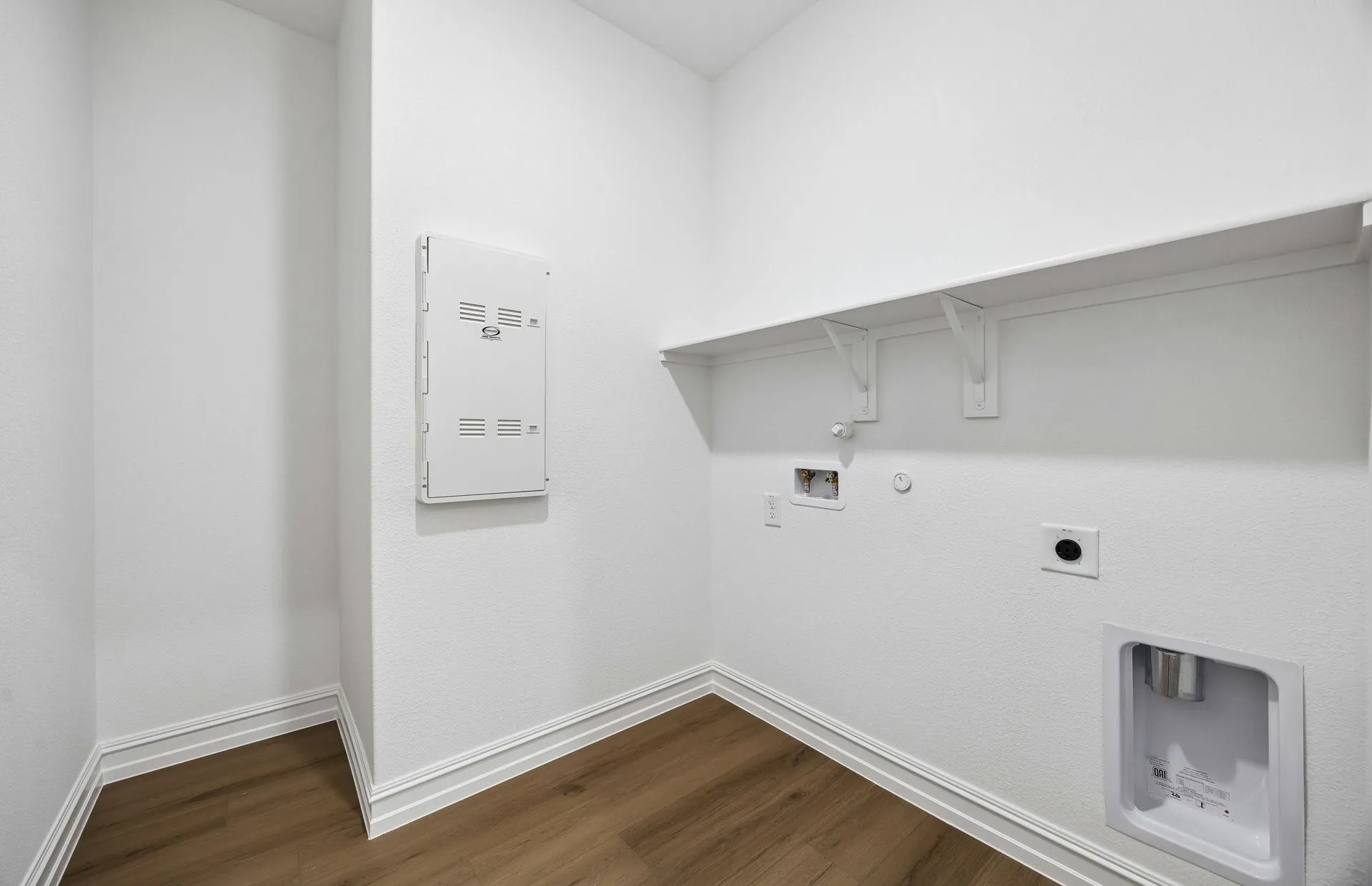 Laundry room with built-in shelving