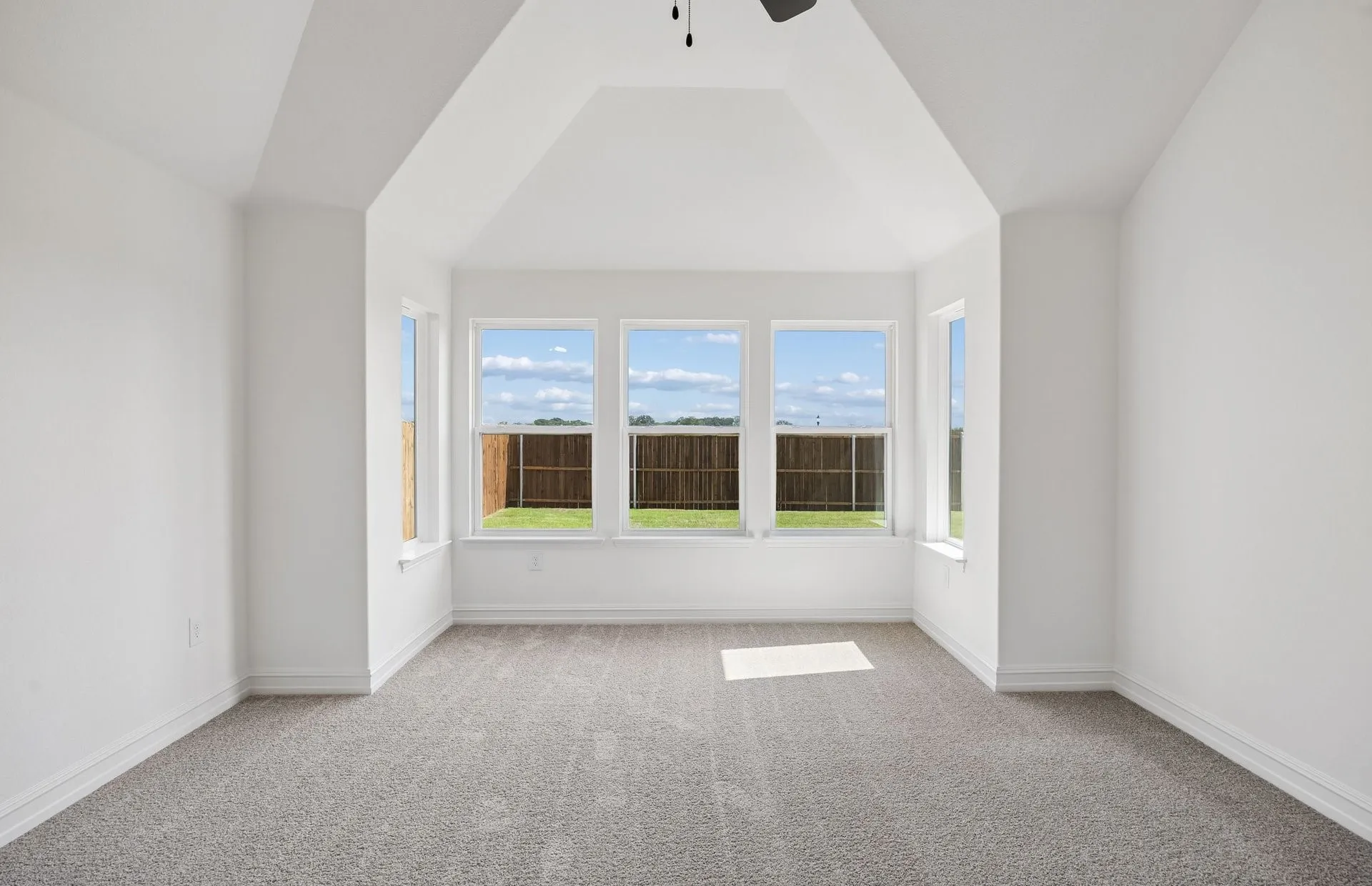 Vaulted ceiling in primary bedroom