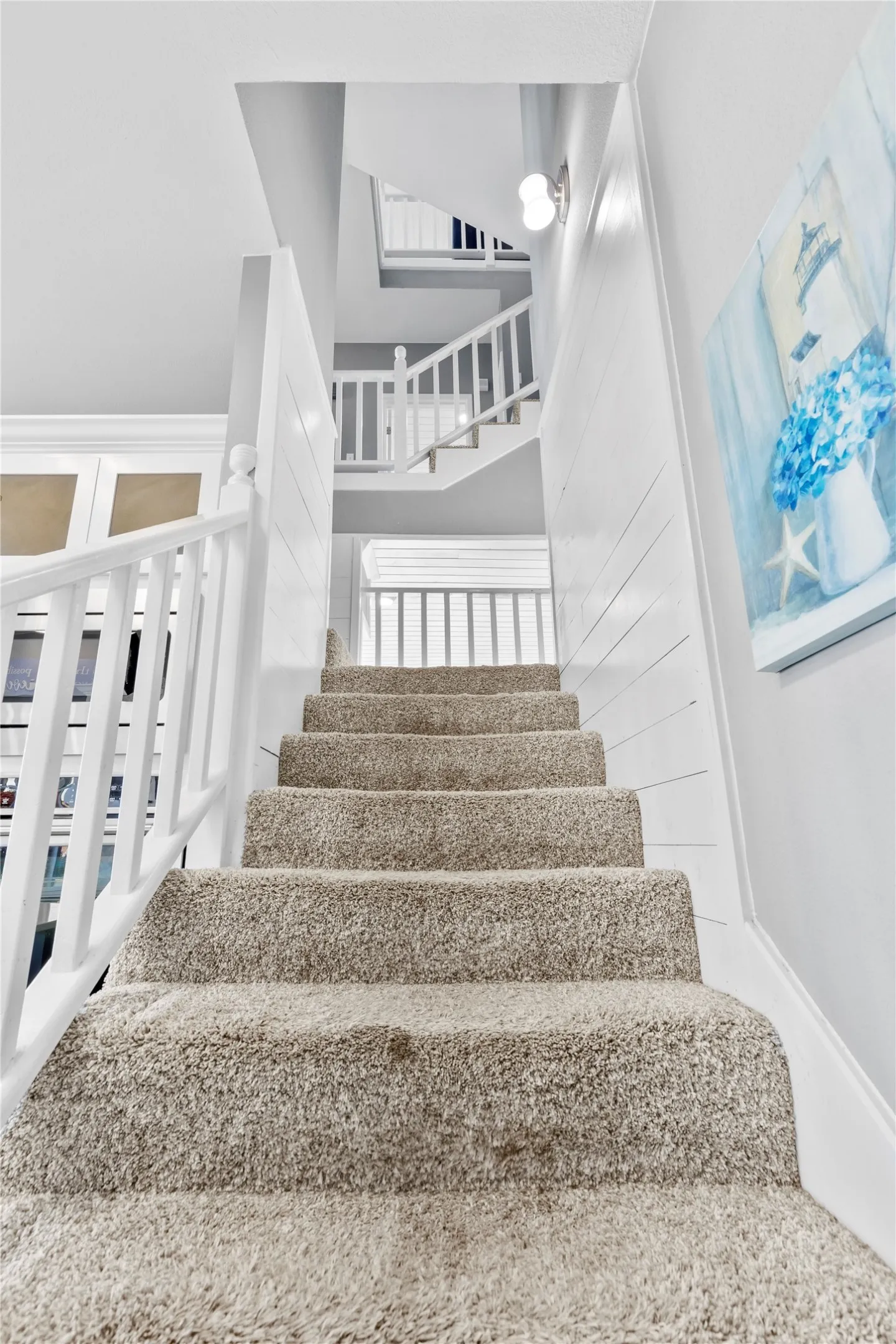 Stairs to second and third floor with two ways to access stairs from first floor
