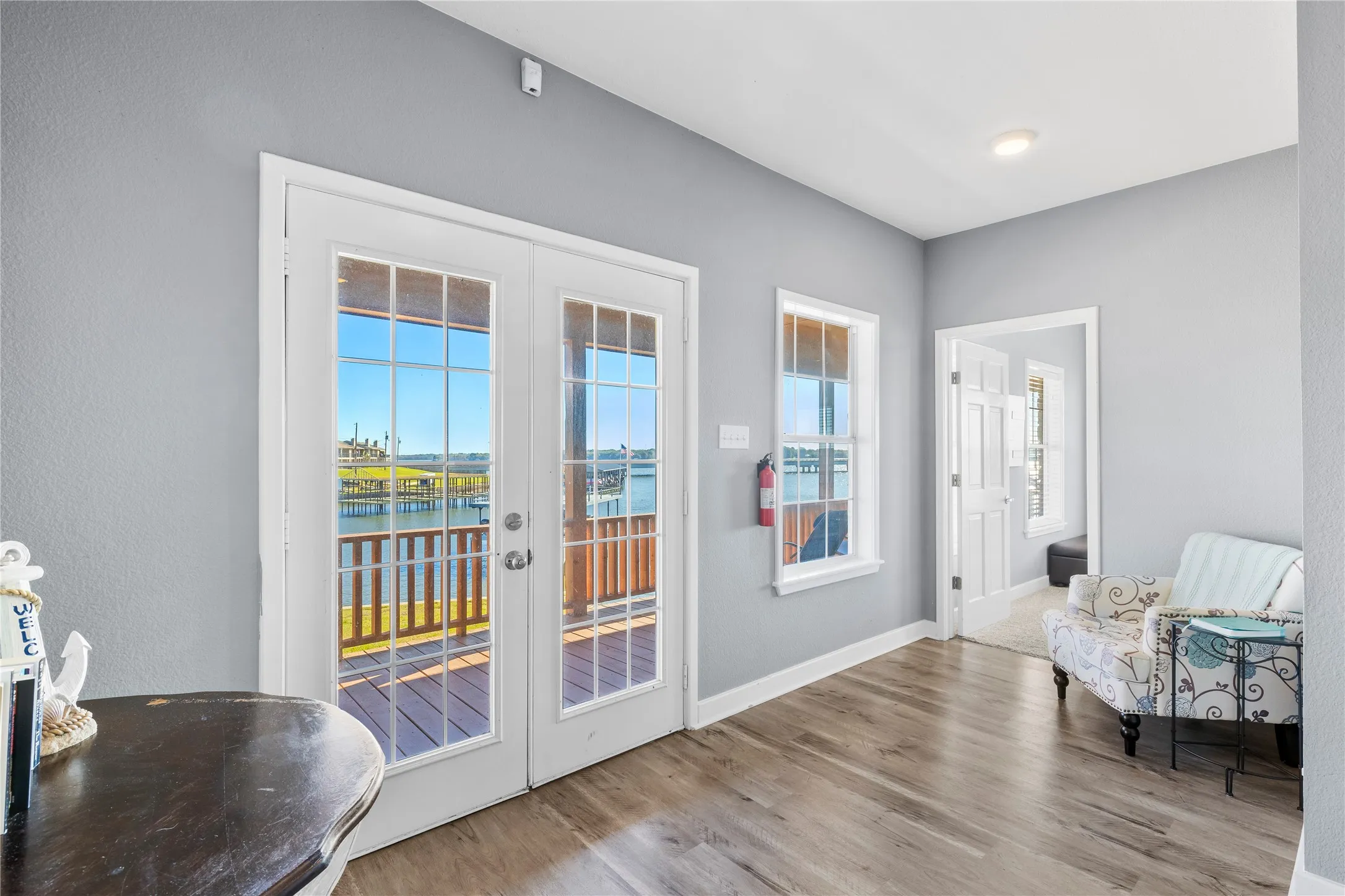 Landing area on second floor with access to covered wrap around porch