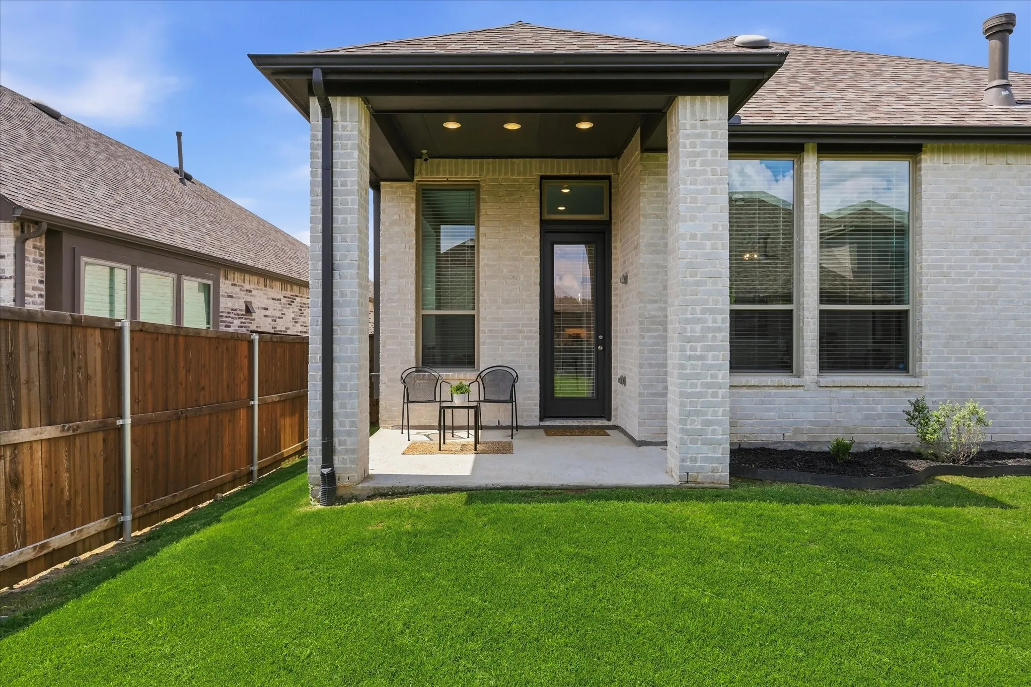 Back patio with gas stub for built in bbq and large yard!
