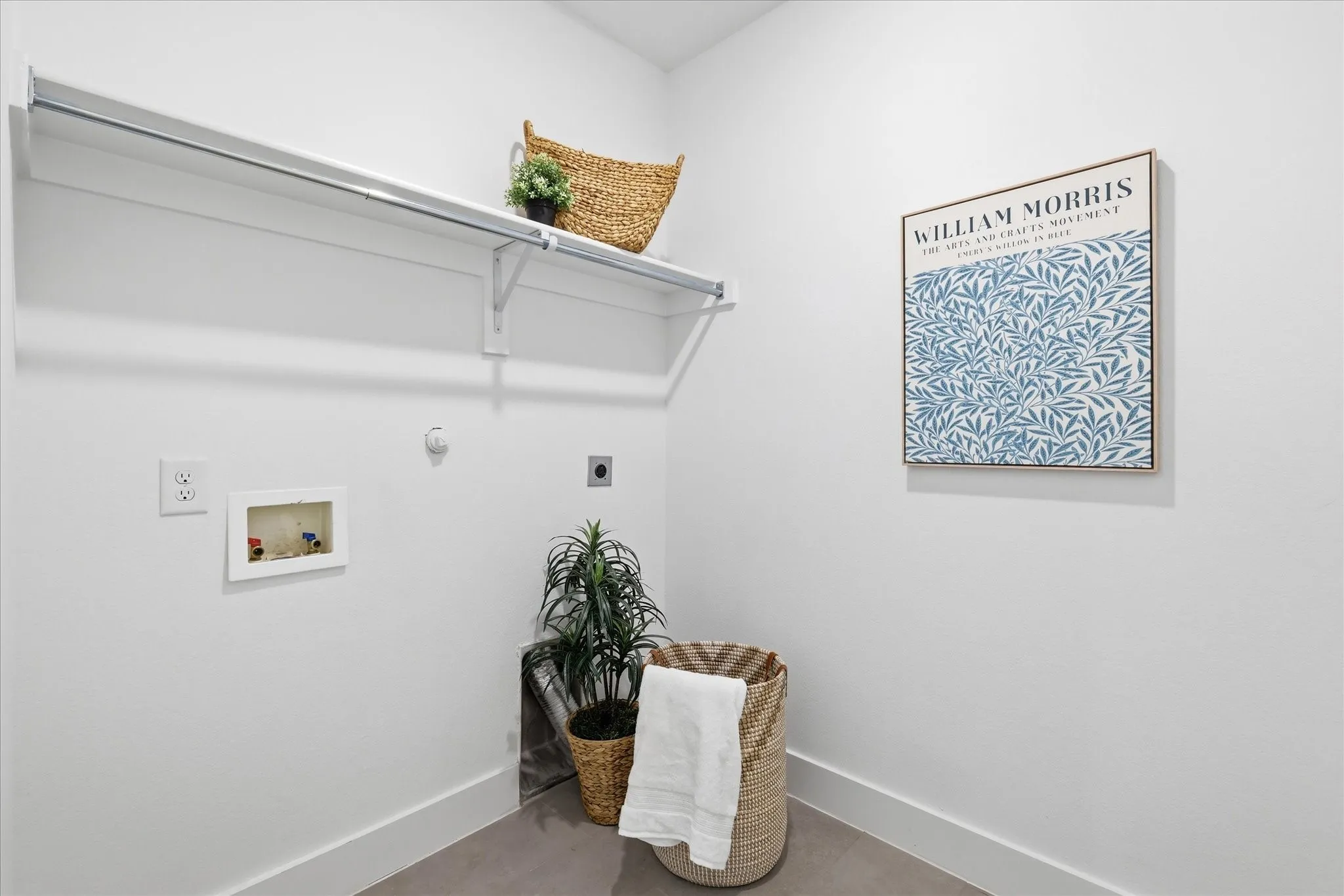 a large laundry space with area for additional freezer or fridge