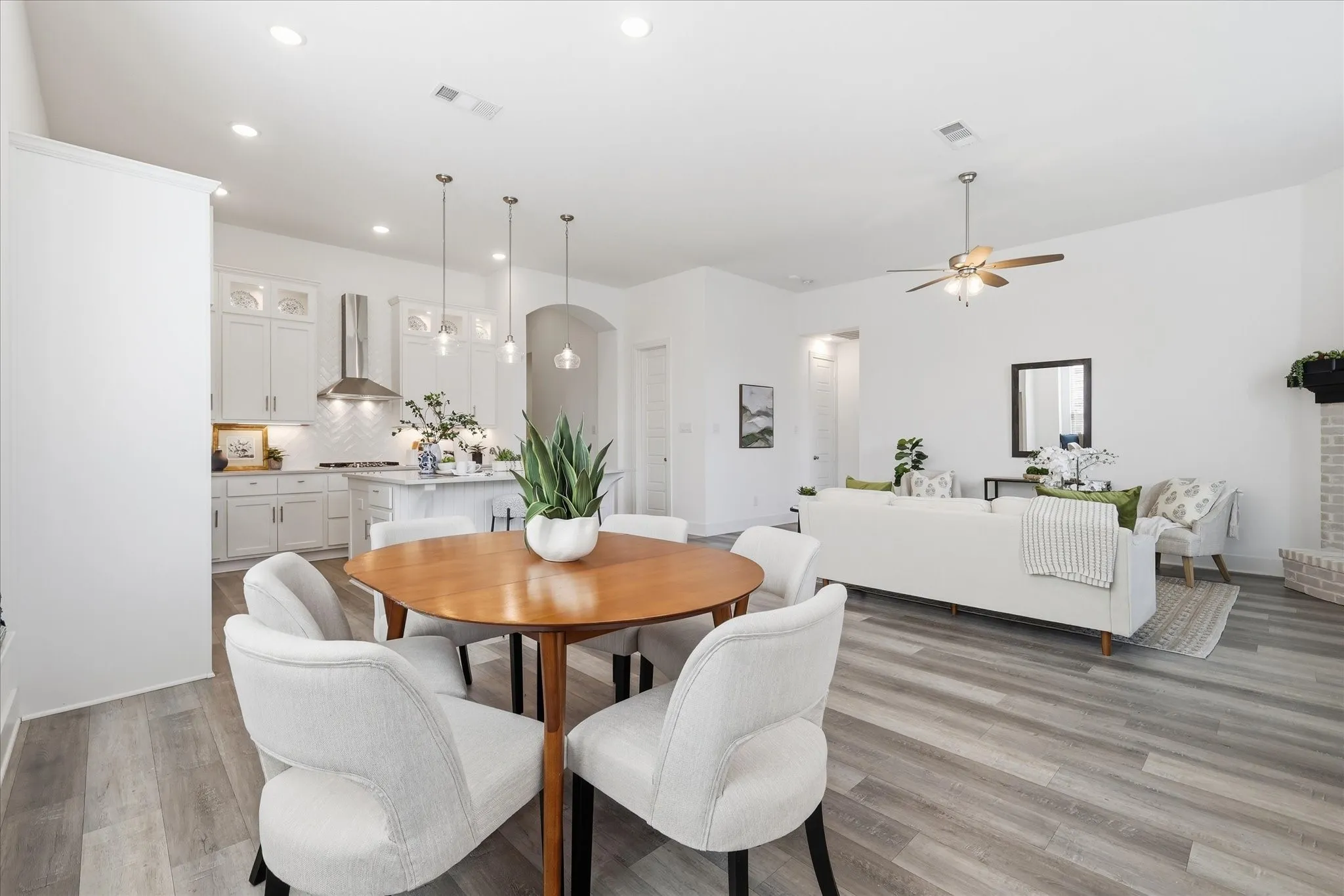 Open Concept dining area with custom bench seating, natural light and fresh paint!