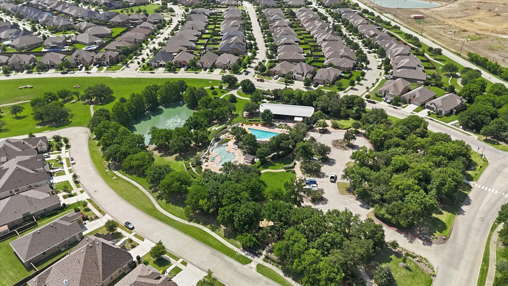 The Haven, where the main pool and clubhouse is located including a splash pad, playground, and outdoor area.