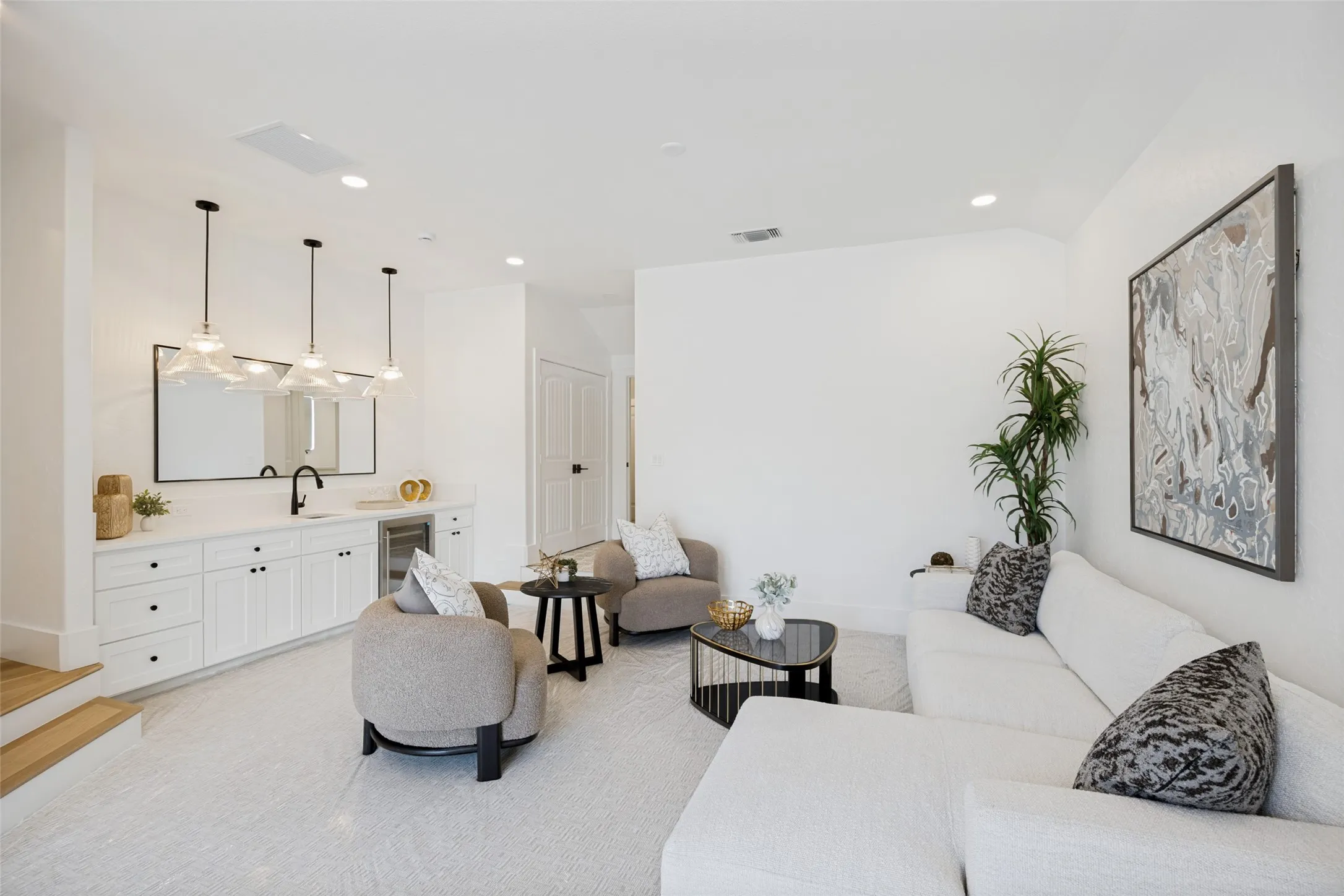 The game room with wet bar and beverage chiller