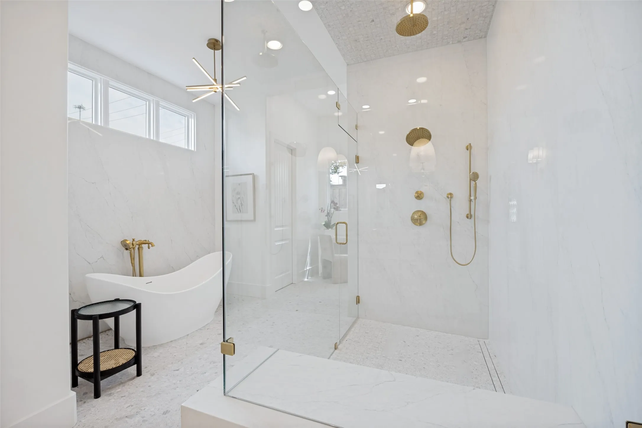 Elegant tub, glass clad shower with 2 heads + handheld
