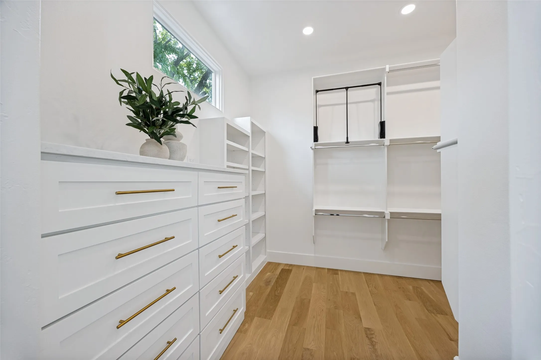 One of the two large walk in primary closets