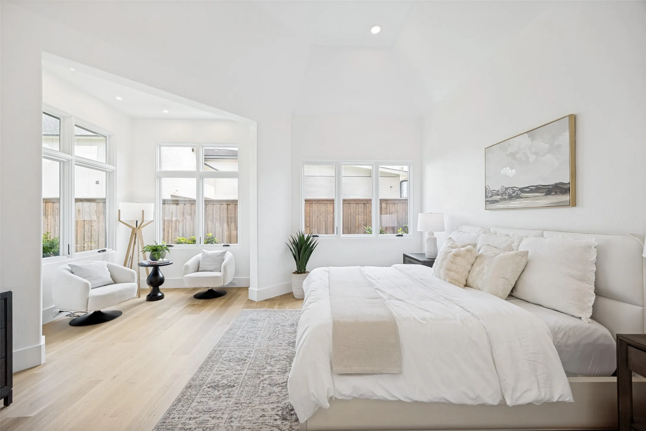 Primary bedroom with sitting area.