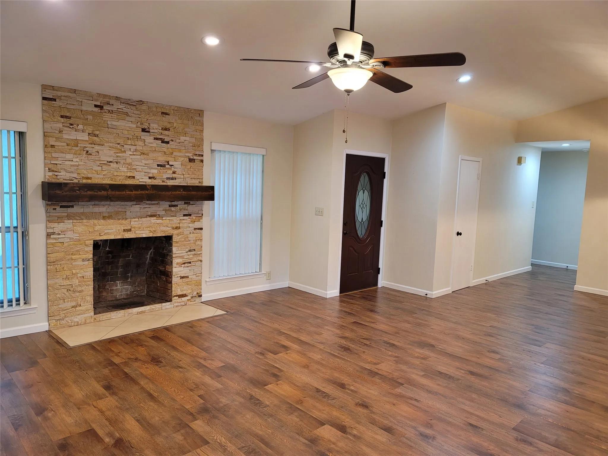Livingroom featuring fireplace and ceiling fan