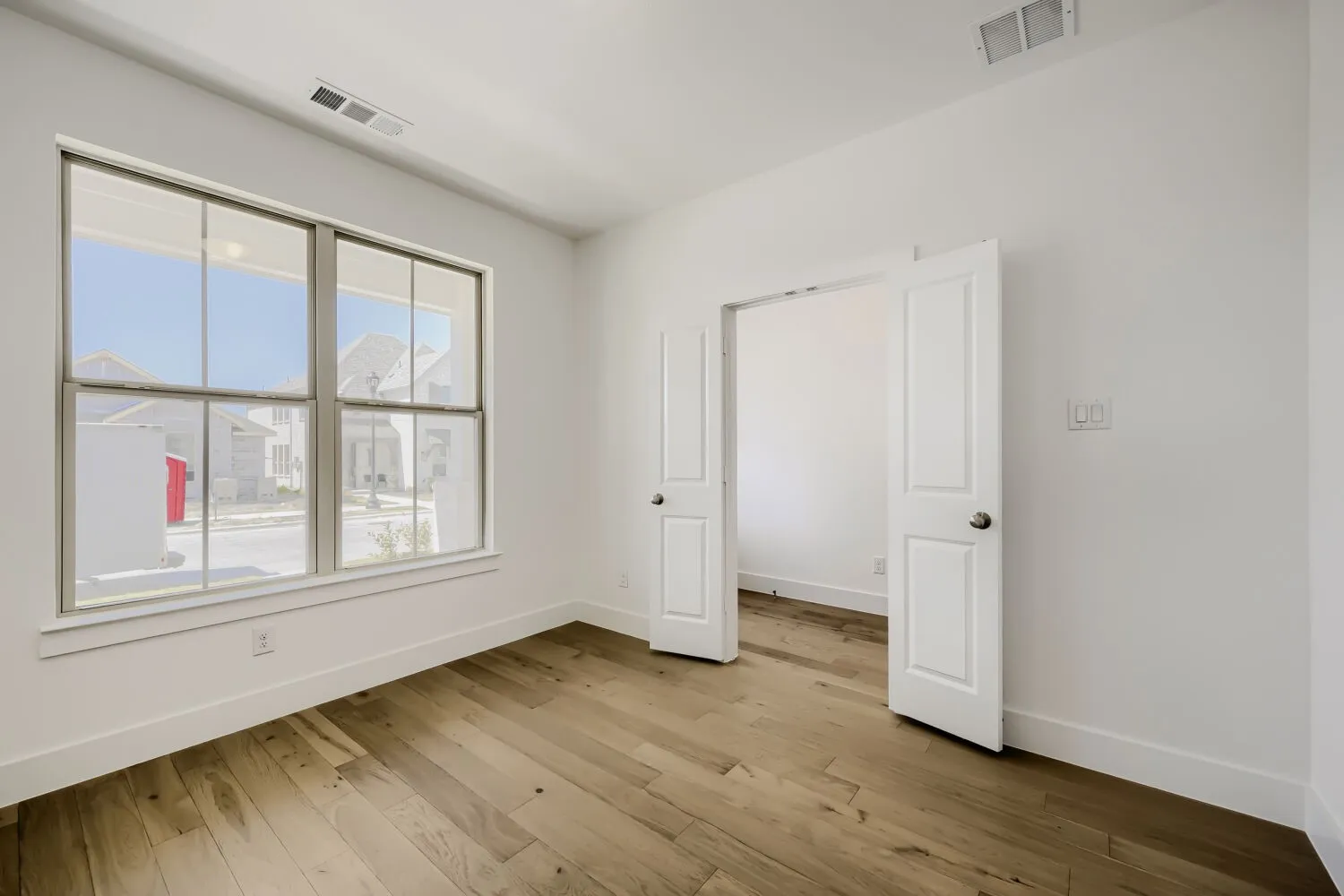 Virtually Staged Photo - White interior walls with recessed lighting