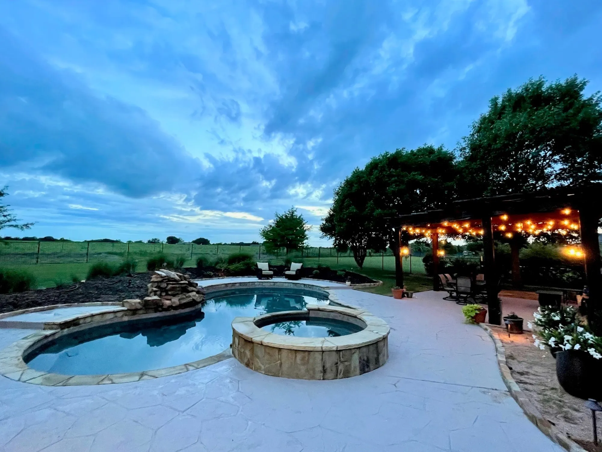 Enjoy the beautiful sunsets across the pasture behind property