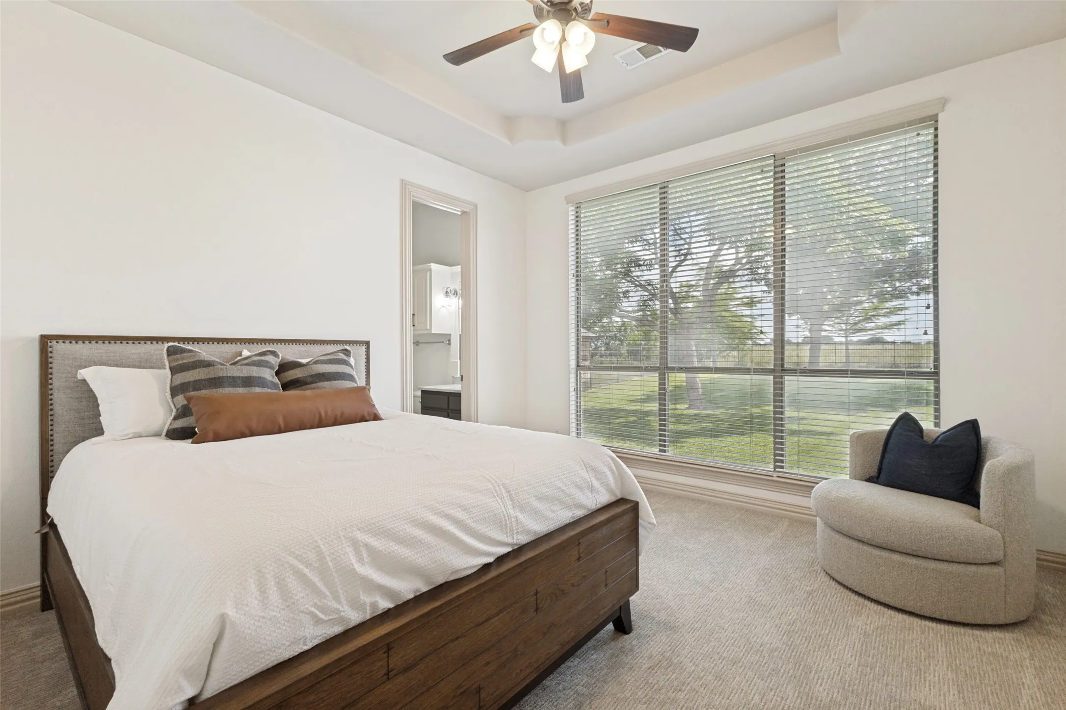 There are three secondary bedrooms down. This offers a private ensuite.