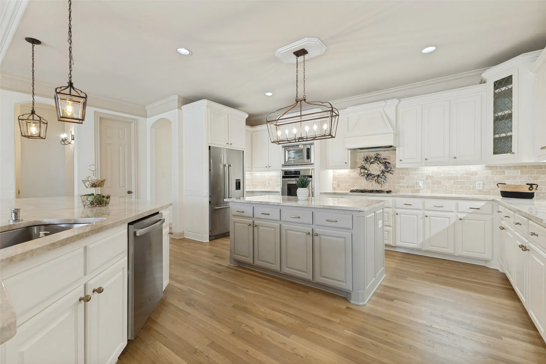This kitchen! Beautifully done with tons of space for serving and entertaining Leaded glass cabinet doors.
