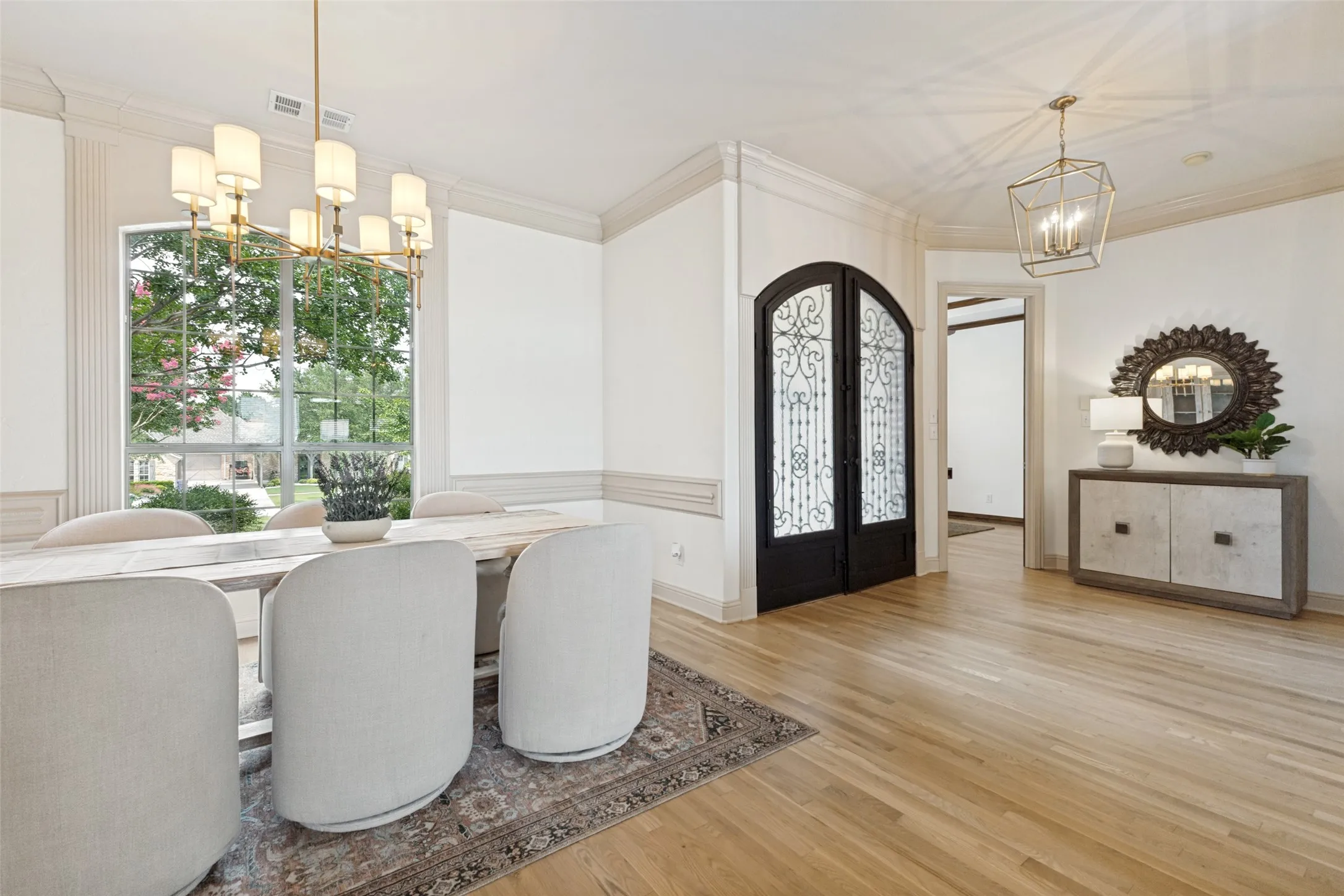 Formal dining with huge windows and rich white oak flooring