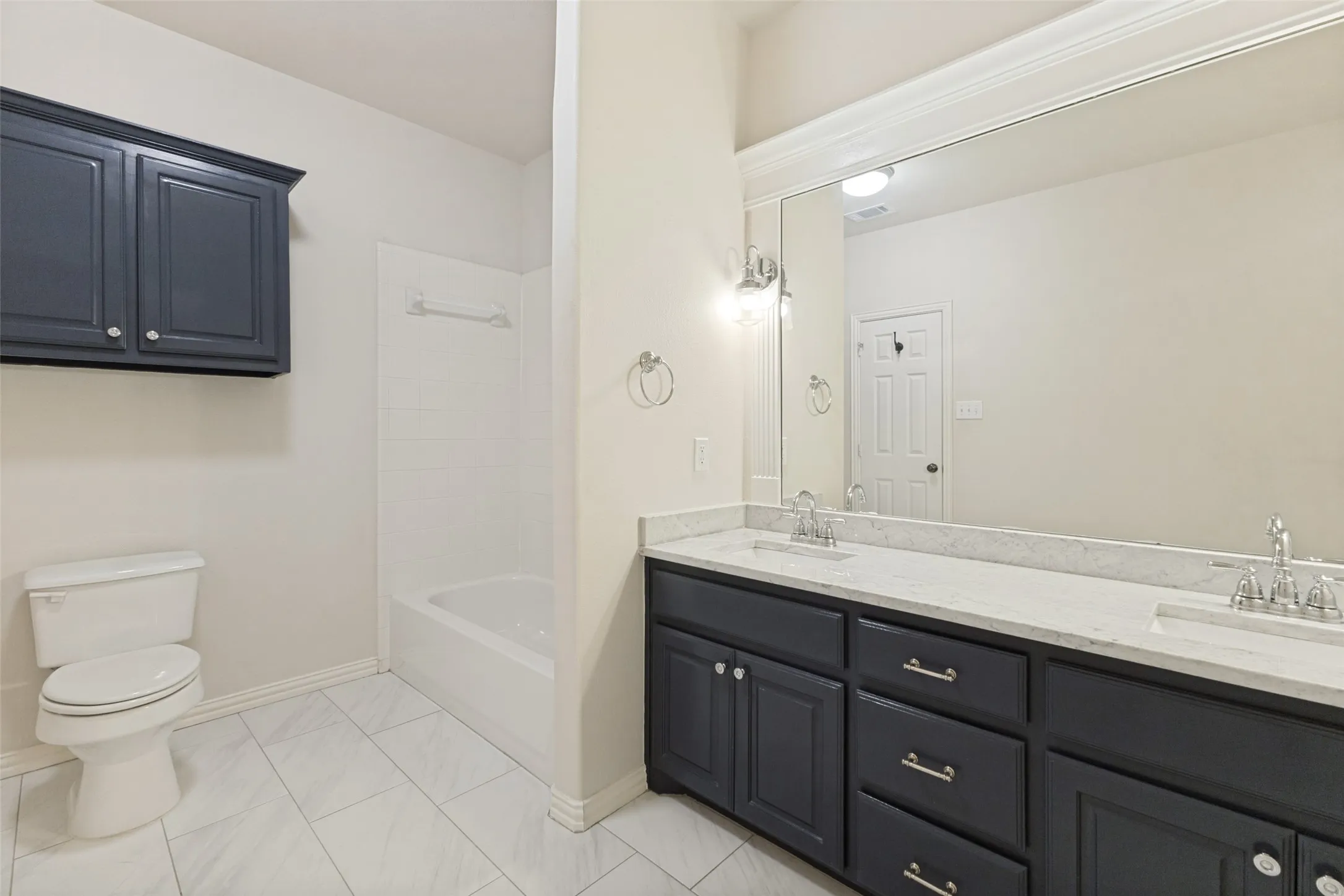 Baths are updated with new fixtures and lighting