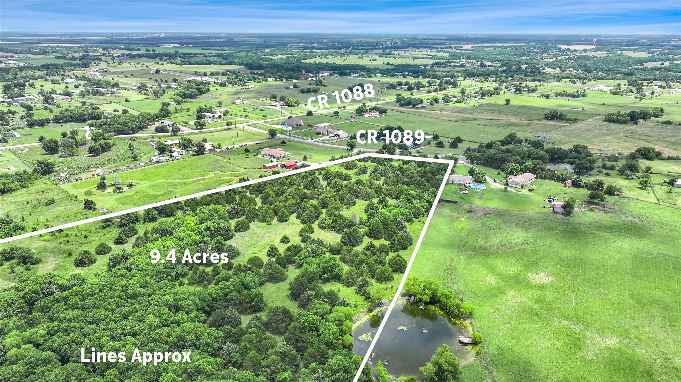 Expansive 9.4-acre parcel featuring dense tree coverage and a private pond