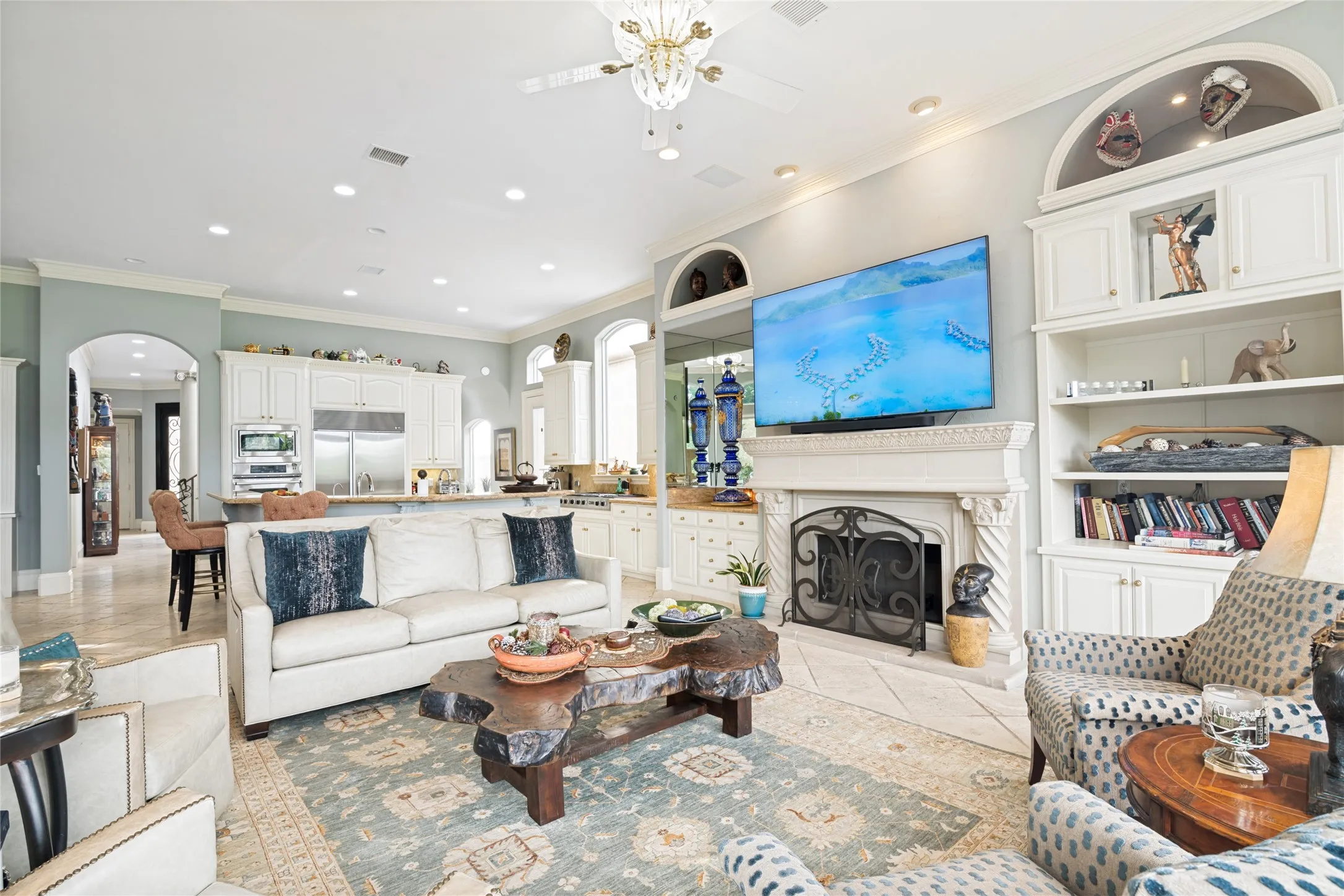 Family room fireplace with massive cast stone mantel
