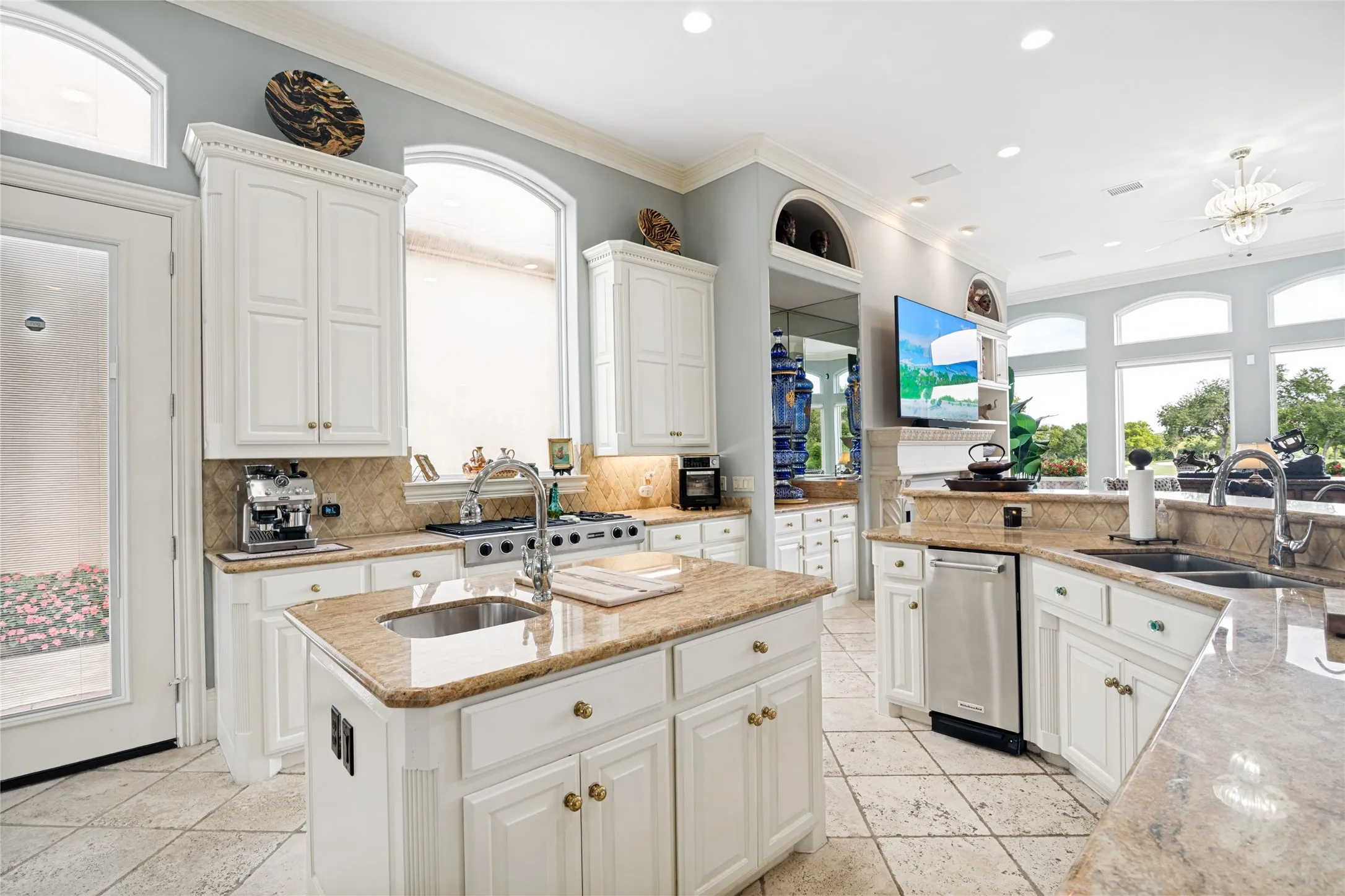 Huge window over the cooktop allows lots of natural light to spill into the house