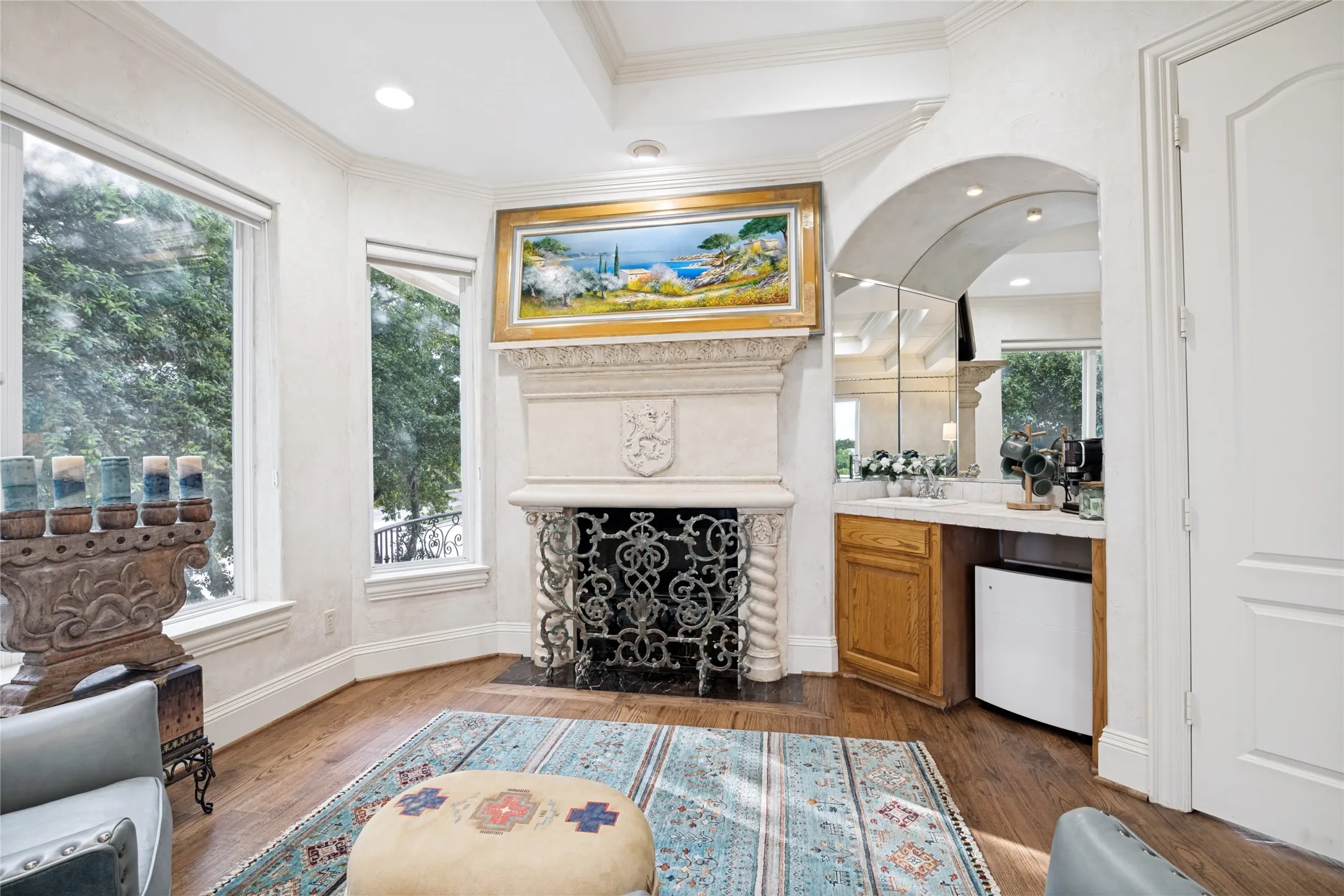 Sitting area in Primary Bedroom with great views, fireplace and bar area.