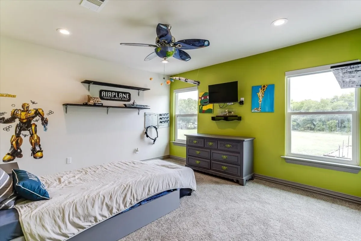 Spacious room featuring carpeting, recessed lighting, and a ceiling fan