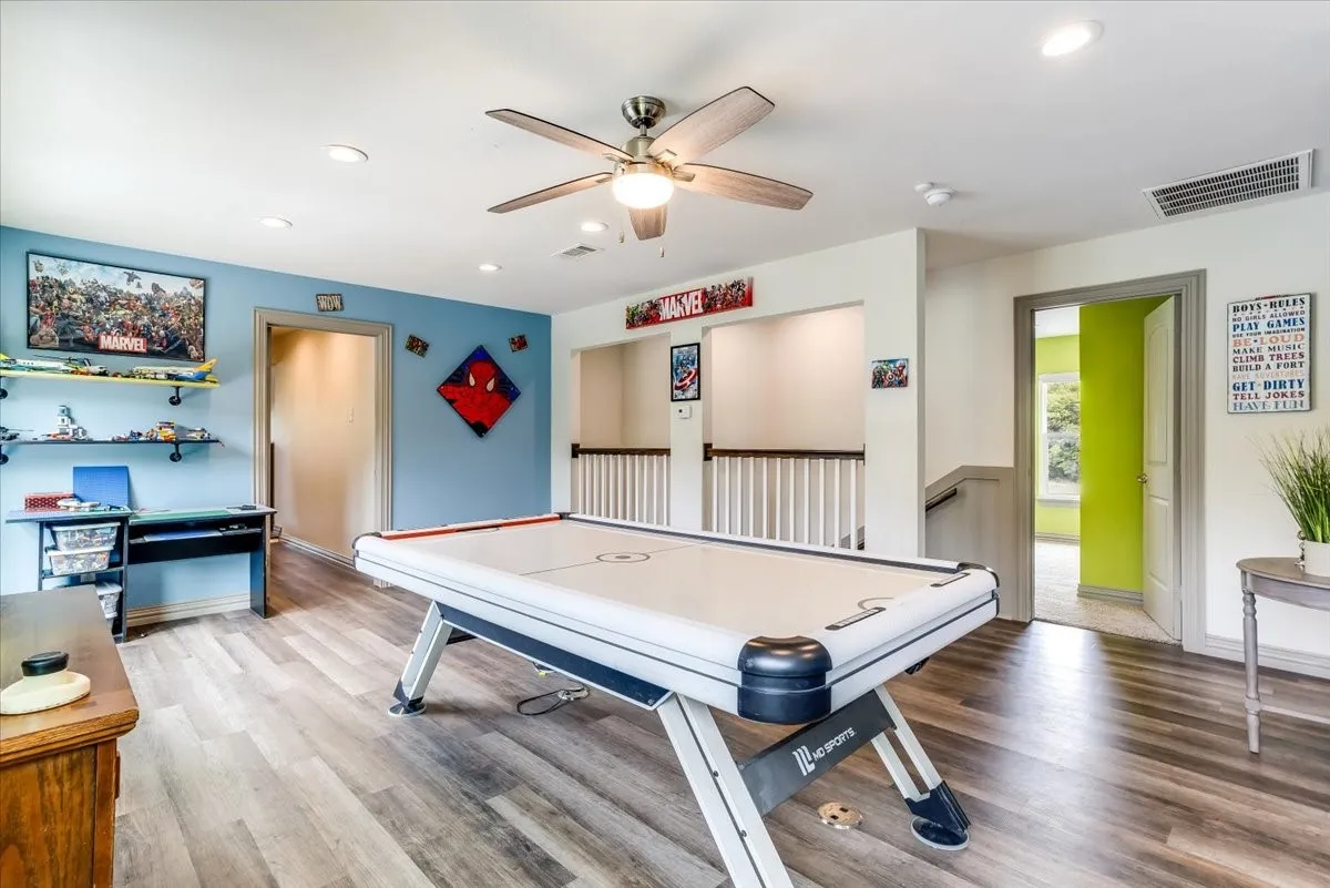 Spacious bonus room featuring wood-finish flooring, recessed lighting, and a ceiling fan