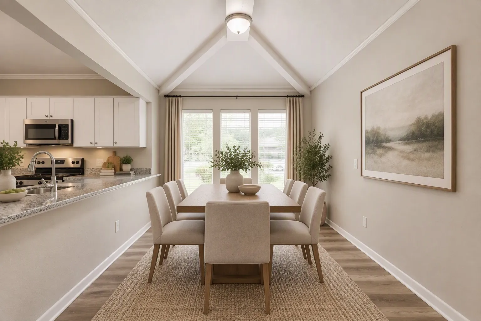 Dining area featuring a vaulted ceiling and wood-finish flooring
