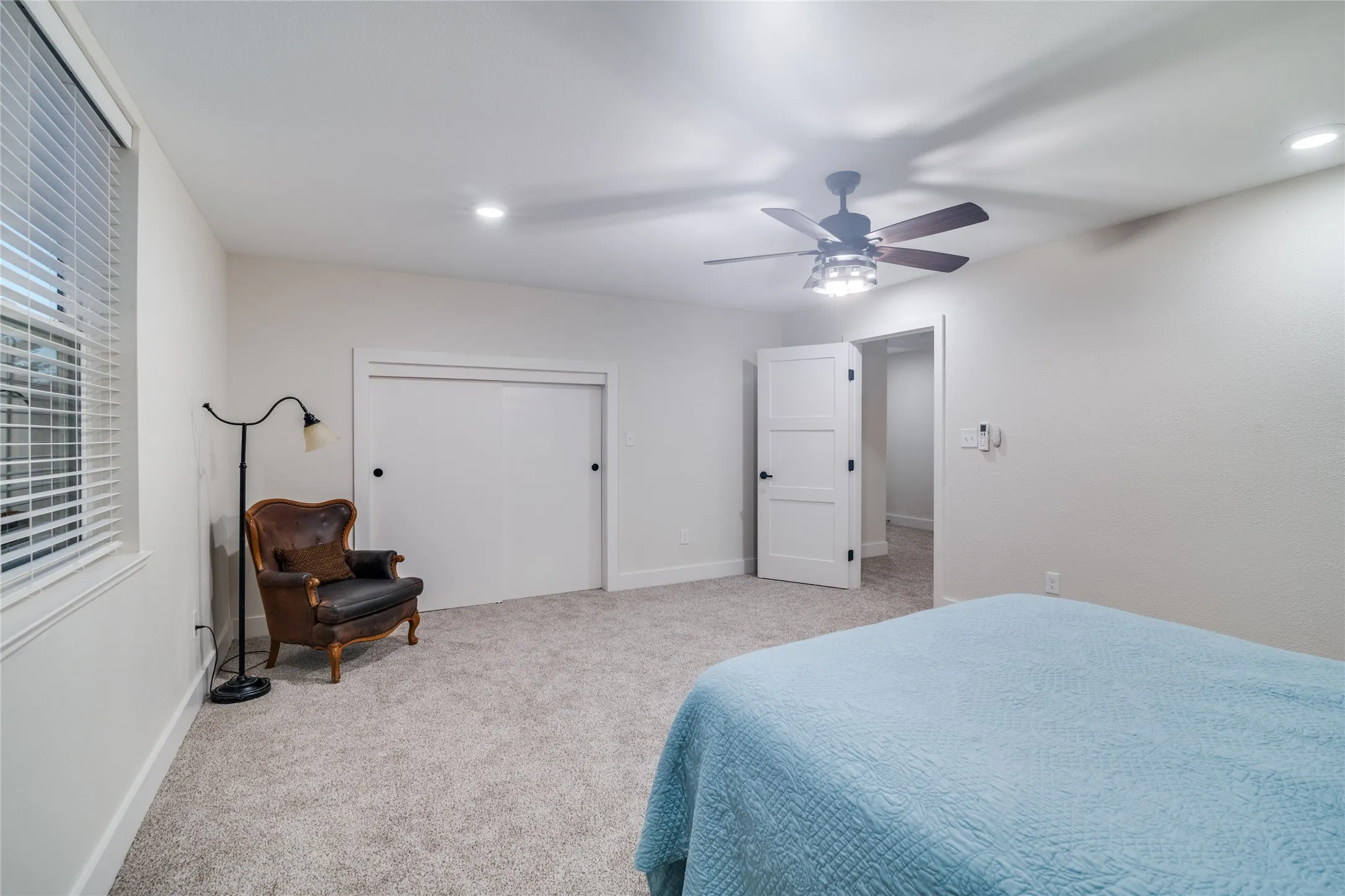 Upstairs bedroom with carpet and closet