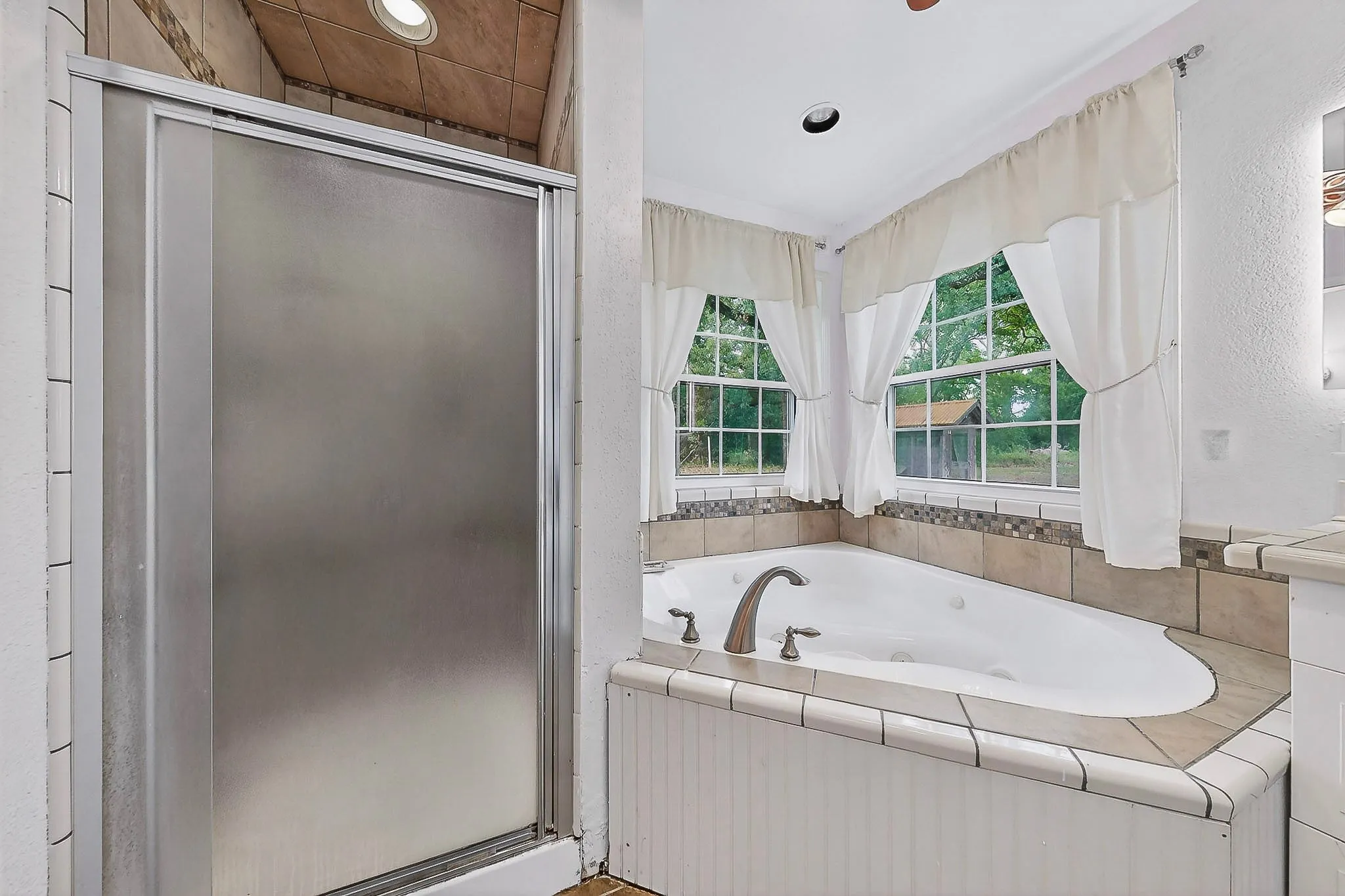 Primary bathroom with separate shower and tub.