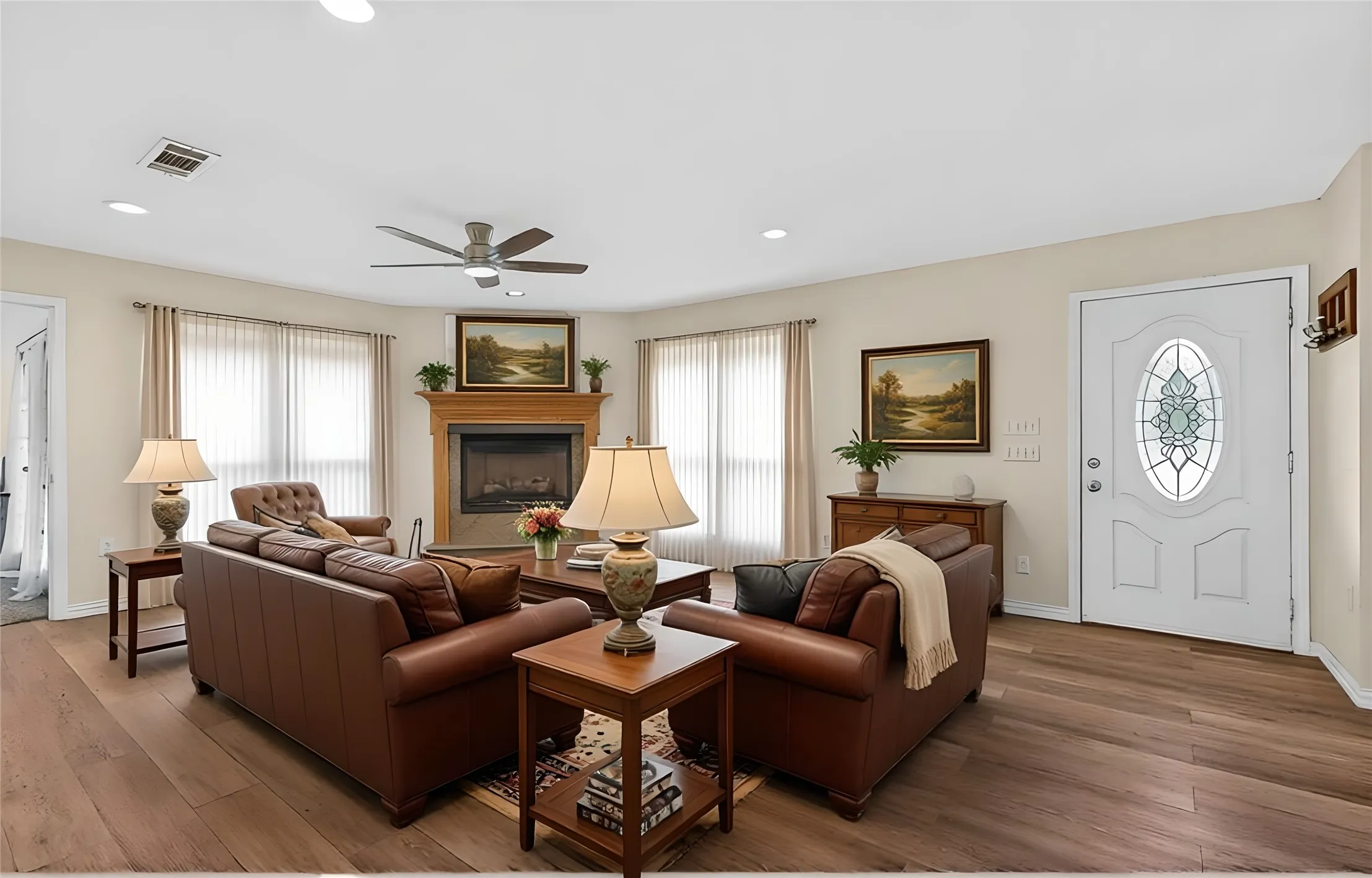 Virtually staged family room with fireplace.