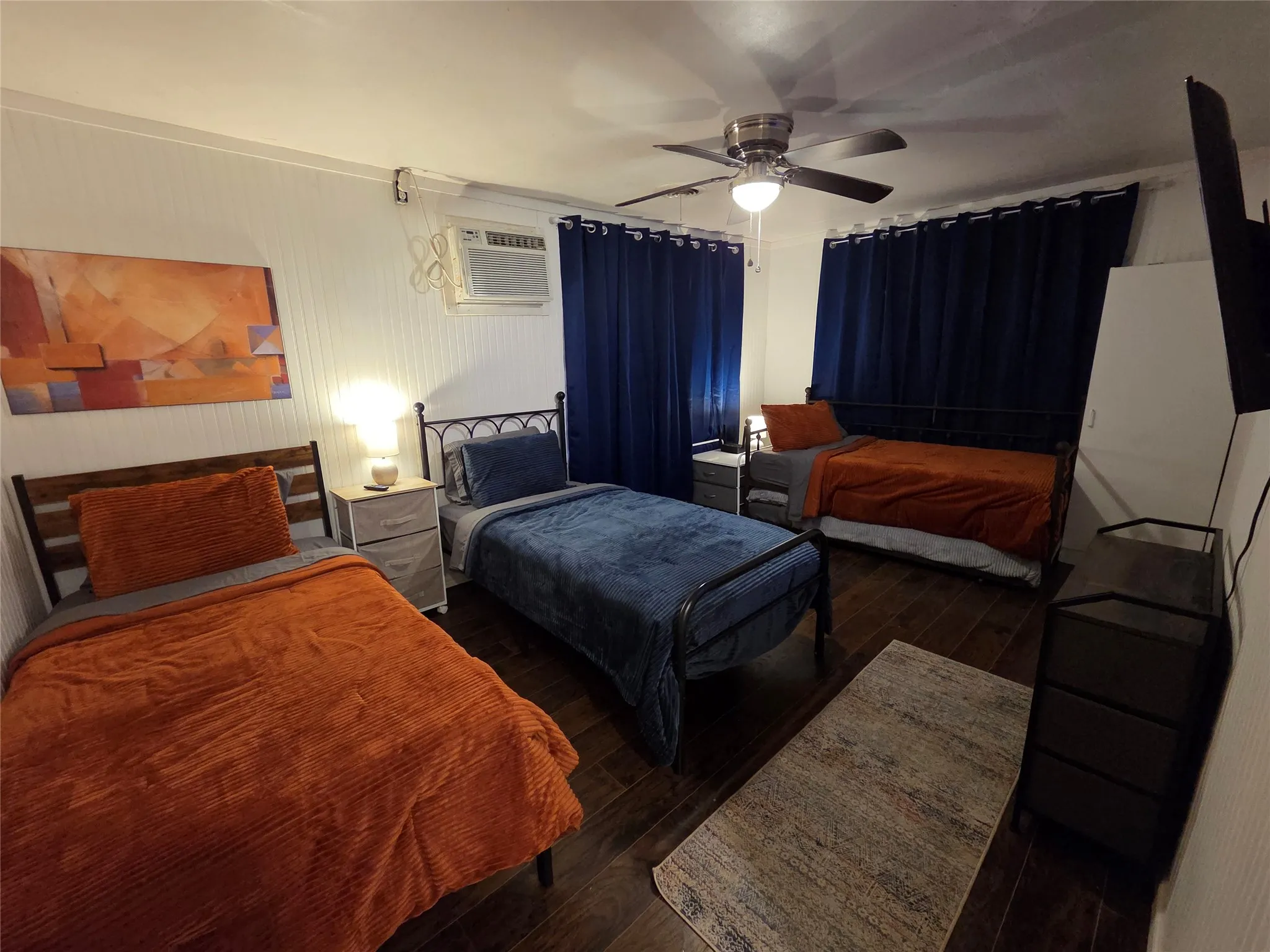 Oversize bedroom with 3 twin beds. There is a 4th twin bed tucked away under the trundle. **WE ARE OPEN TO CHANGING OUT BEDS IF THIS DOES NOT SUIT YOUR NEEDS**