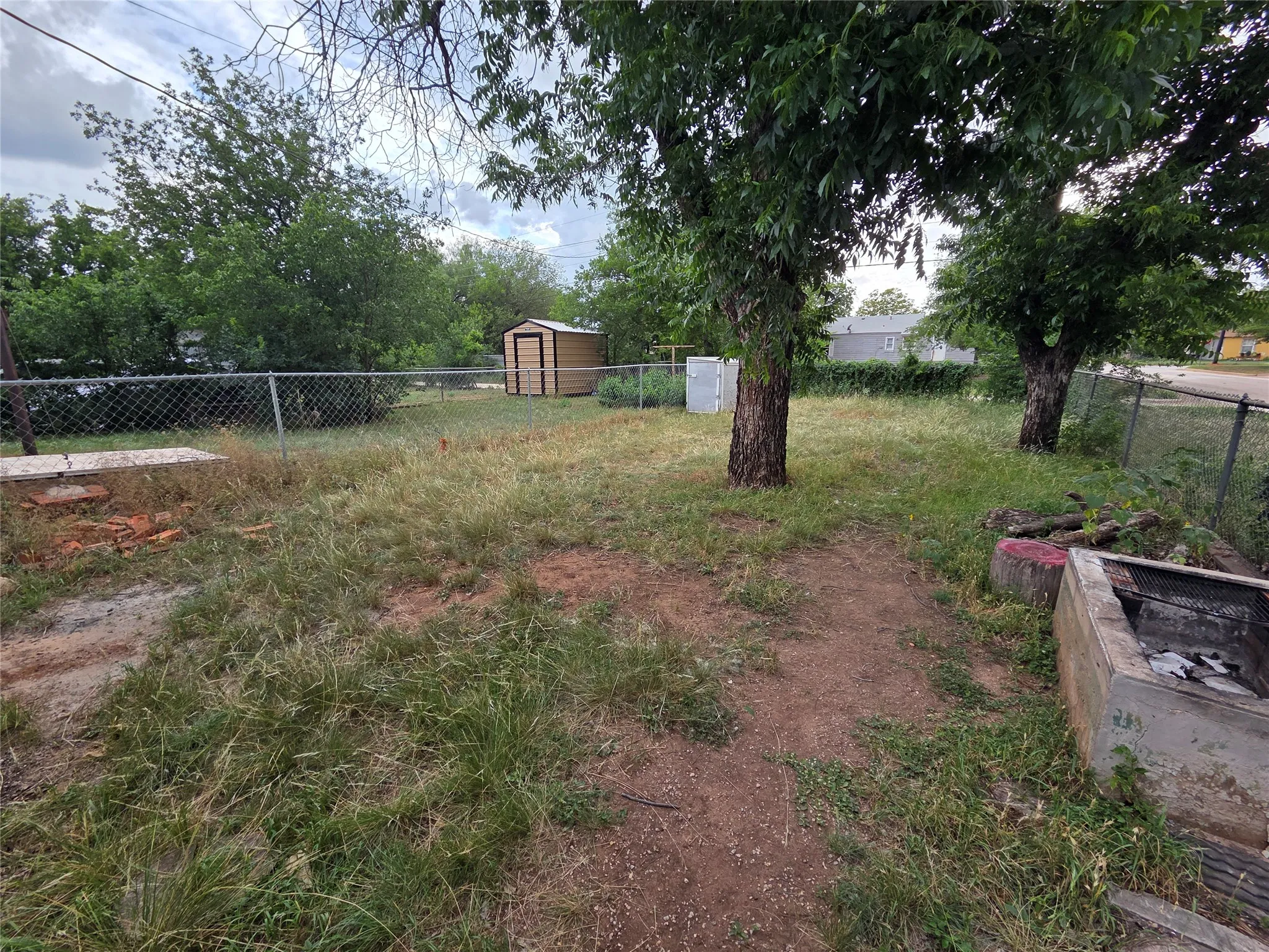 Shot of the backyard. Chainlink fenced.
