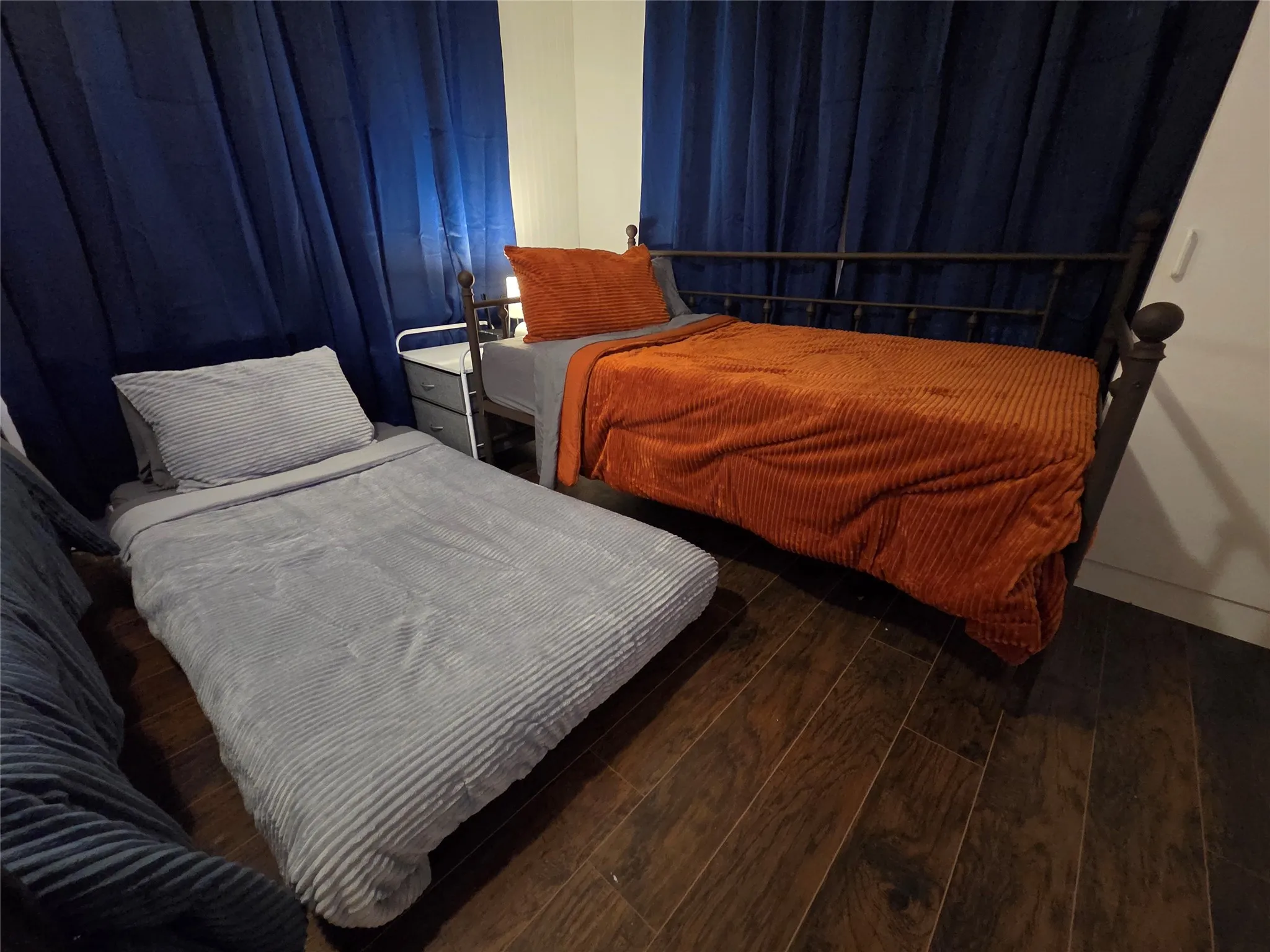 Trundle twin bed with extra twin bed rolled out. The extra bed sits at floor level, but is on wheels. **PLEASE NOTE WE ARE WILLING TO CHANGE THE BEDS IF THIS ARRANGEMENT DOES NOT WORK FOR YOU**