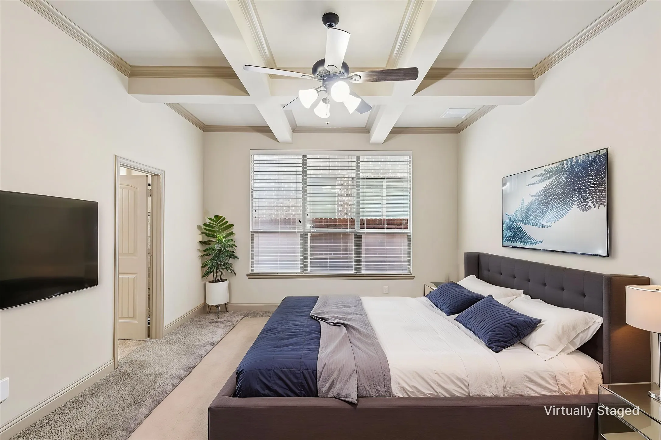 Primary bedroom Coffered ceiling with a ceiling fan light fixture, window with blinds, paneled interior door, and carpet flooring