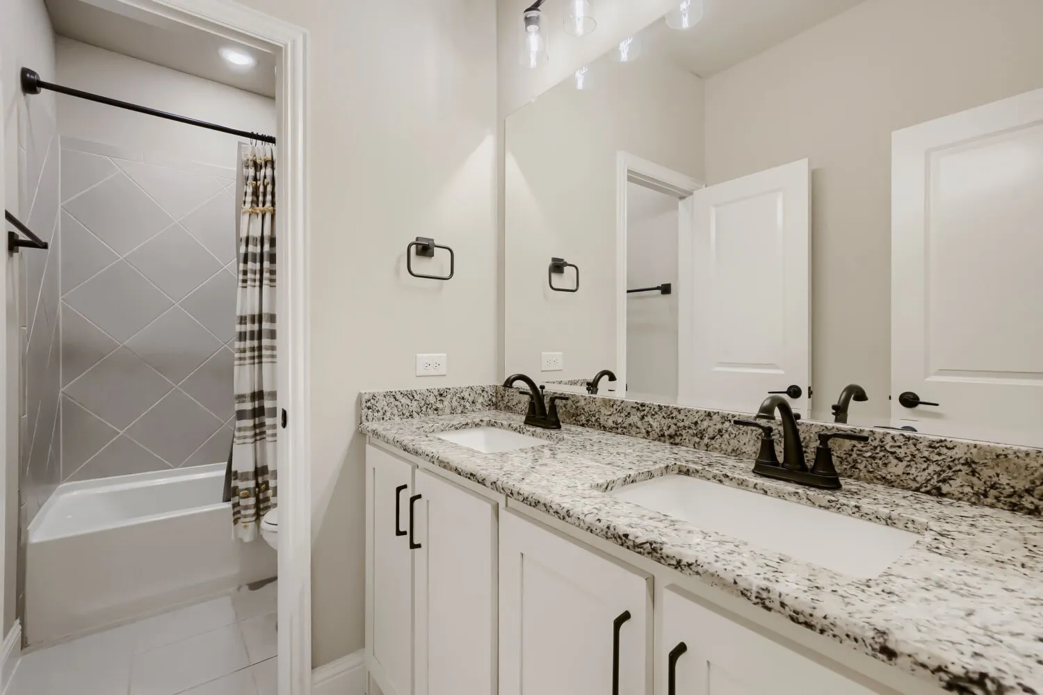 Double vanity with granite countertop and undermount sinks