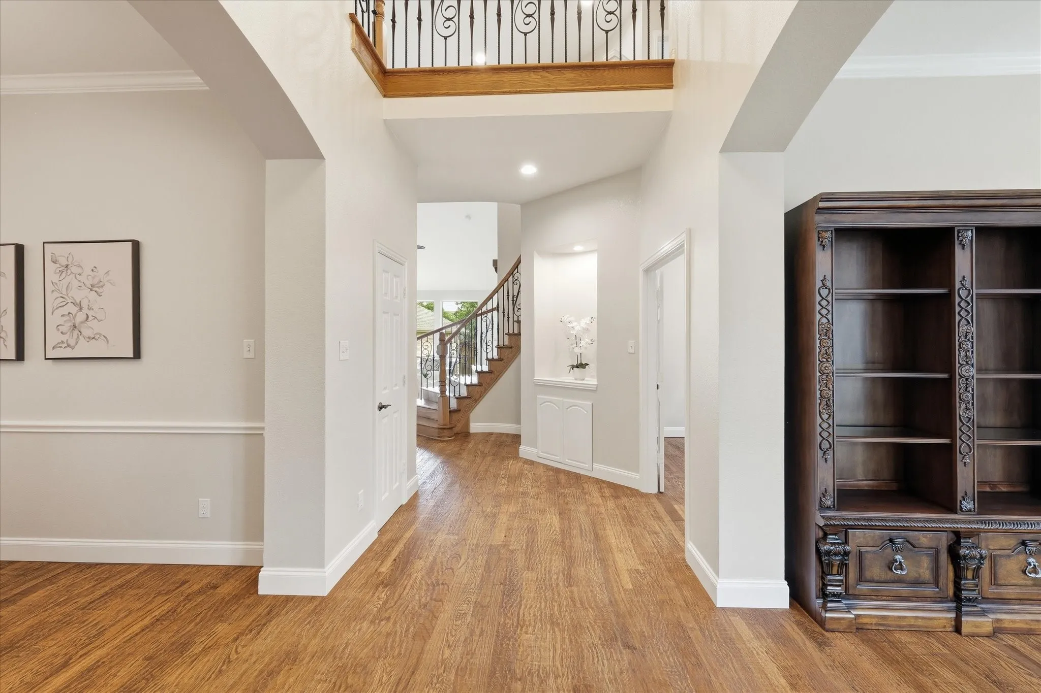 From front door, formal living area on the right, dining room on the left. Family room straight ahead.
