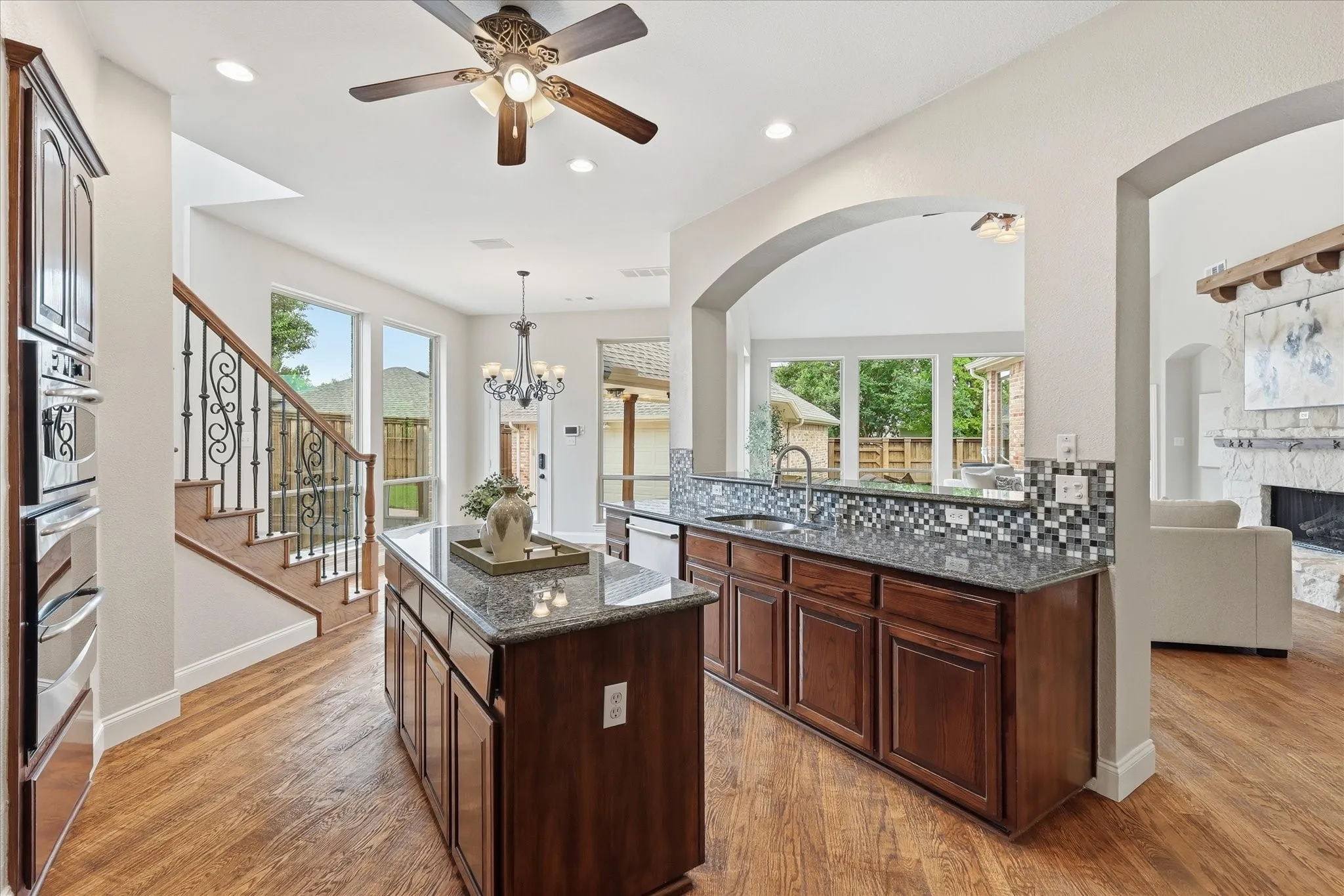Kitchen looking toward breakfast area, back door and second staircase.