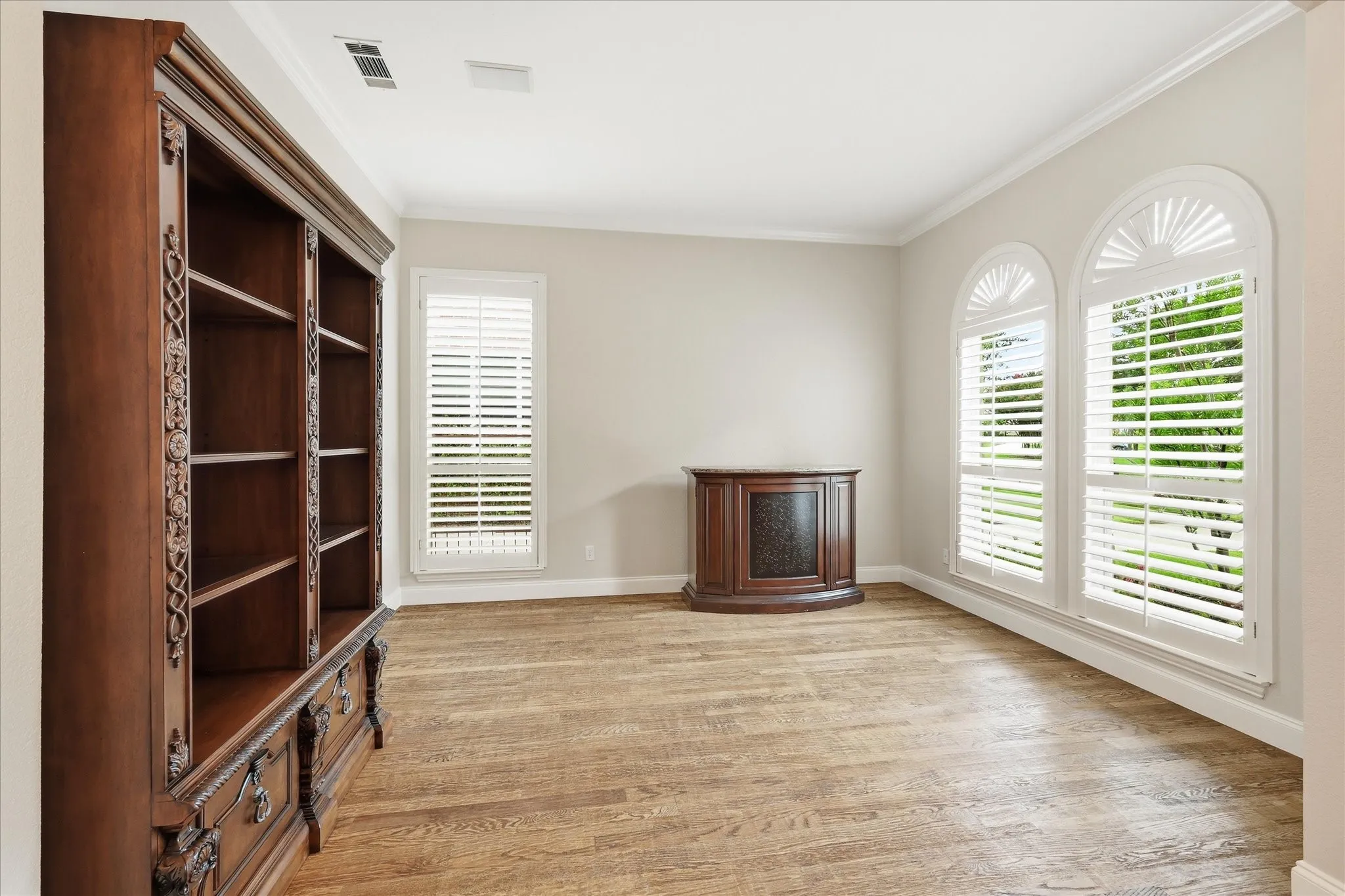 Formal living area. Plantation shutters on the front side of home.