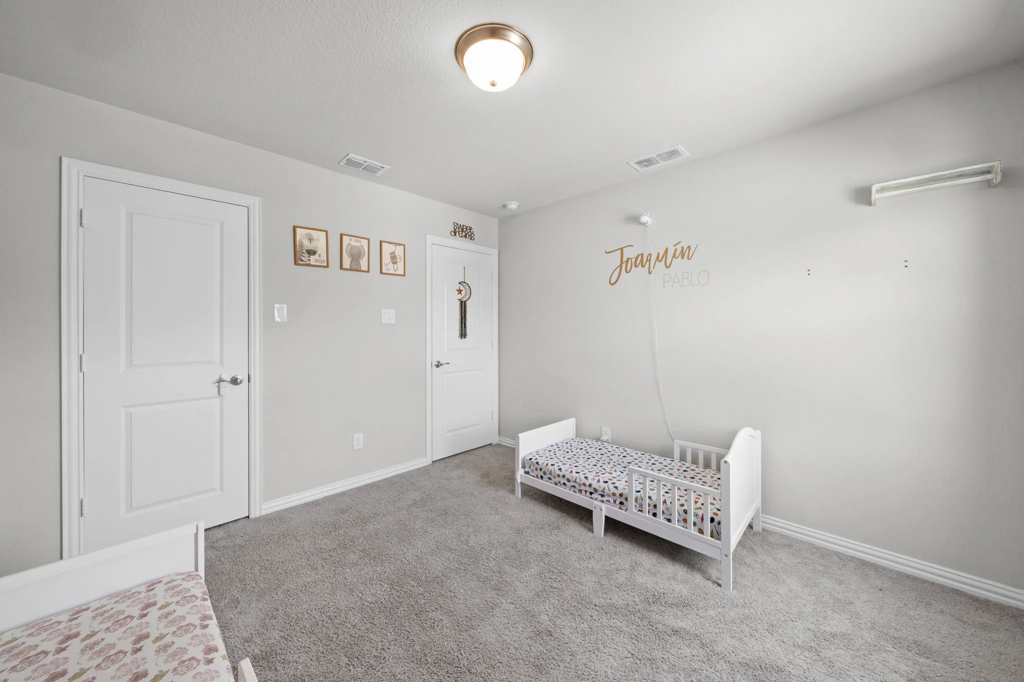 Neutral gray walls complement the gray carpeting