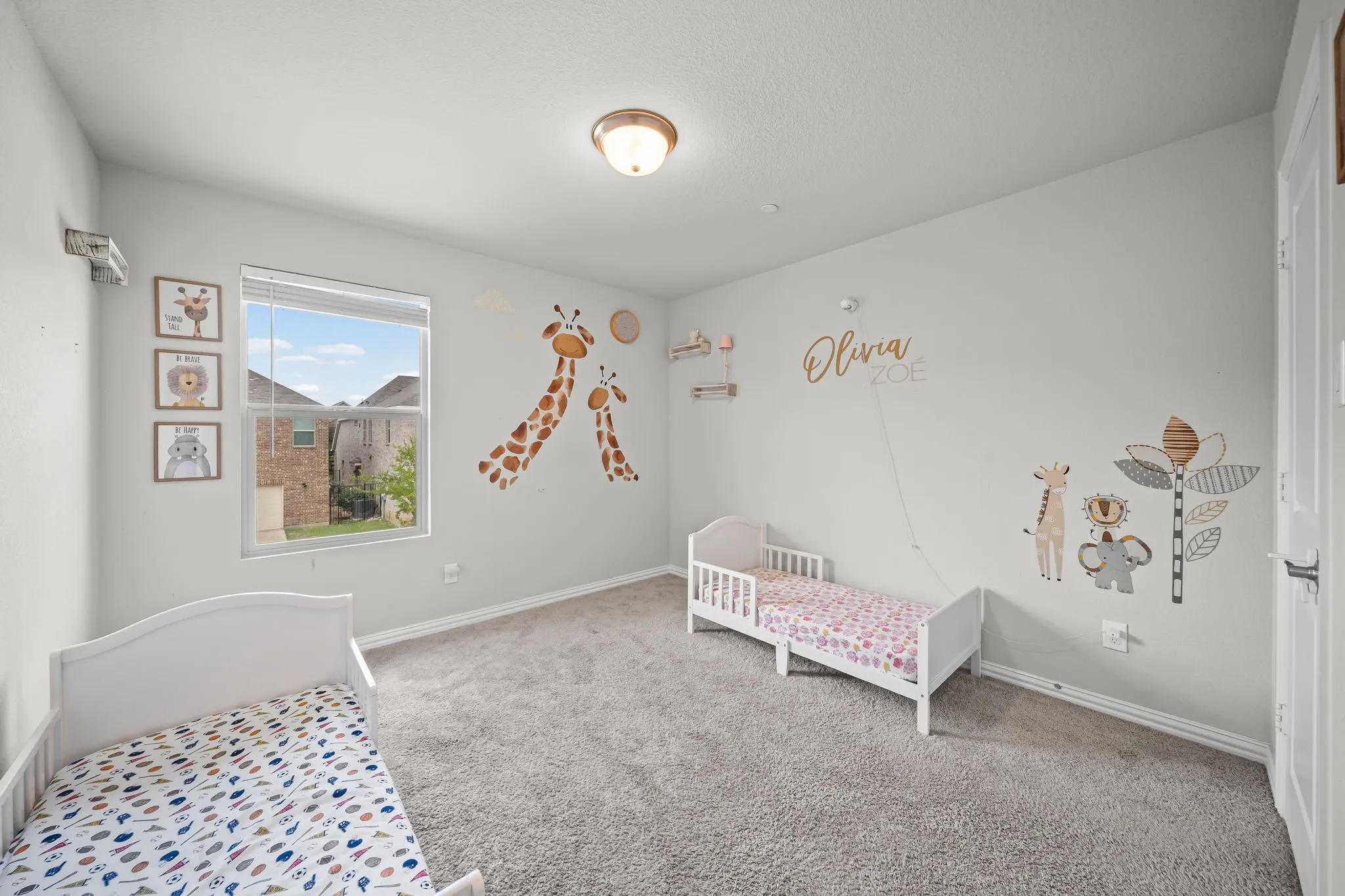 Carpeted room with a single window featuring horizontal blinds