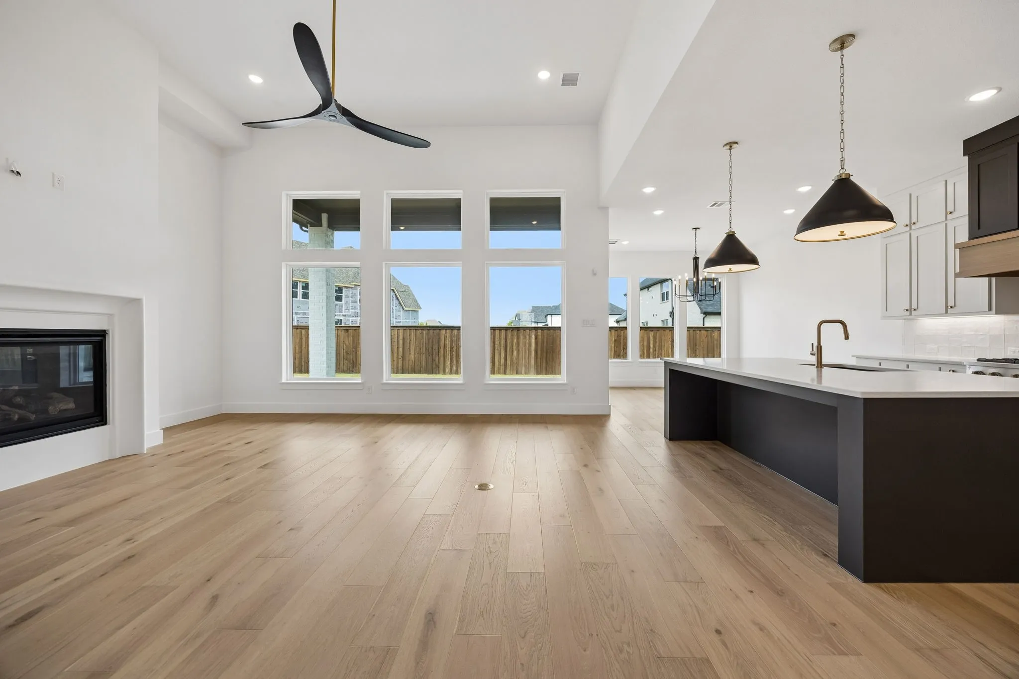 A wall of windows across the back of this dream home floods the space with natural light.